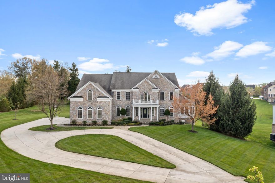 Elegance and sophistication define this luxurious residence nestled in a prestigious gated community. With 9632 sq ft spread across 3 levels, the open floor plan, double staircase, and catwalk create a majestic ambiance in the 2-story foyer and family room. Revel in the comfort of separate dining and formal living rooms, a family room, eat-in kitchen, office, and bonus room.

Boasting 5 bedrooms and 4.5 baths, the primary suite is a sanctuary with a sitting room, his and her closets, vanities, shower faucets, and a fireplace. Elevate your lifestyle with an elevator, sunroom, and 3 gas fireplaces. The finished basement offers entertainment options like a theater room and fitness room. Exterior offers 4-sided stone, 3-car garage, irrigation, and a circular driveway accommodating 15 cars make this property the epitome of opulence and convenience.