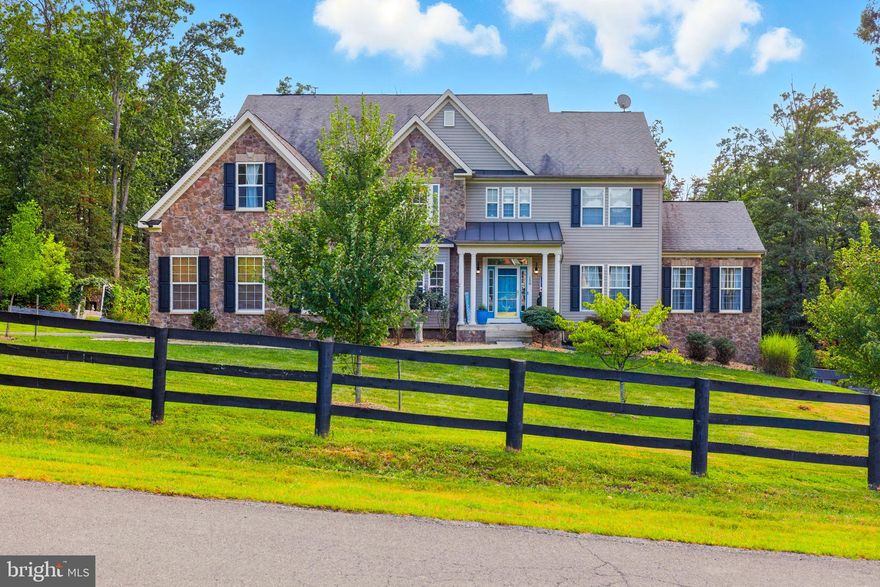 Welcome to Equestrian Estates, a sought-after Winchester community with no HOA, where this stately 5-bedroom, 6-bath Colonial offers over 6,700 square feet of beautifully finished living space on nearly 3 acres. Originally built in 2007 and extensively updated in 2020, the home showcases high-end finishes throughout, including fully renovated bathrooms with luxury details such as smart toilets, heated floors in the primary suite, and upgraded kitchen appliances. Designed for both elegance and everyday function, the layout features a dual staircase, a spacious open-concept living, dining, and sunroom area filled with natural light, a gas fireplace, a private office, and a built-in desk in the kitchen perfect for a home workspace. Three bedrooms, including the primary suite, feature private en-suite baths, ensuring comfort and privacy for family or guests. The fully finished lower level offers 1,714 square feet of additional living space, featuring two spacious flex rooms ideal for guests, a home gym, or creative workspace, plus a second kitchenette, full bath, and theater room. With private walkout access, this level is ideal for entertaining, extended family, or multi-generational living. Outdoor living is equally impressive with expansive decks, a hardscape patio set away from the home with a wood-burning chimney stack, and a flourishing garden that adds both charm and privacy. A three-car garage, private cul-de-sac setting, and easy access to Route 50 and downtown Winchester complete this exceptional property that combines space, elegance, and lifestyle flexibility.