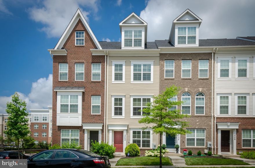 Don't miss this eight-year-old -4-story garage townhouse with 2 Primary suites.  This property has approx-1596 sq ft with a rear garage and driveway. Upgrades include custom countertops, backsplash, mahogany hardwood floors, 42" kitchen cabinets, and an extended island with stainless steel appliances. The half bath is also on this level and the dining area with a balcony.  There is a good-sized living room for entertaining.  Upstairs is a significant primary suite with a full bath, and also, on this level, is a second bedroom and full bath. The next level up is a large third bedroom and full bath. This property has been completely painted, and the carpets have been cleaned.
This property is ideally situated between Baltimore and DC.  Minutes from ICC, 95,495, 295, & METRO