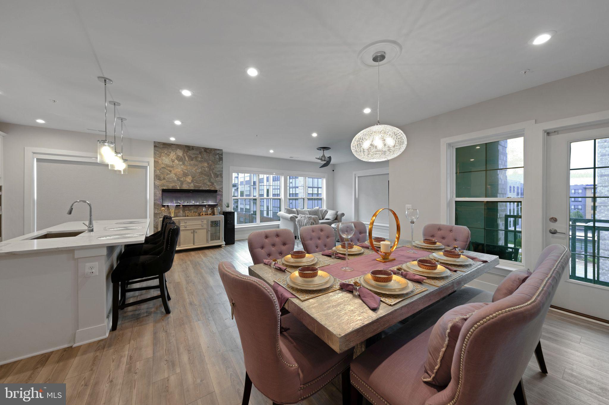 Welcome to 102 St. Ives Place #301, a beautifully appointed 2-bedroom, 2-bathroom condo nestled in the heart of the National Harbor. This spacious residence offers over 1,700 square feet of modern living with an open-concept layout, perfect for both relaxing and entertaining. The gourmet kitchen features a gas cooktop, double oven, and stainless-steel appliances, while the expansive living area has extra natural light as this unit is a corner unit. Enjoy the convenience of in-unit laundry, ample storage, and a private balcony. Located in a secure, gated community with garage parking, this home provides easy access to shopping, dining, and entertainment. Whether you're commuting to D.C. or enjoying a night out at MGM or the Capital Wheel, this condo offers the perfect blend of comfort, style, and location.