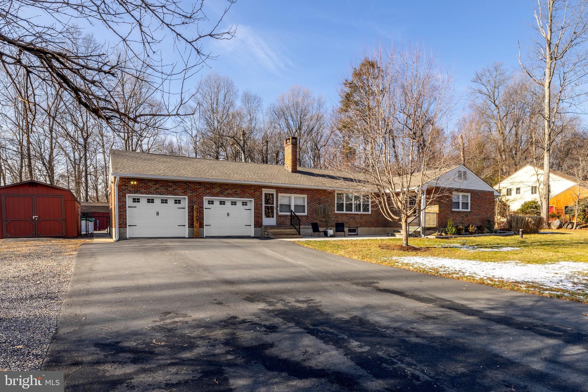 Beautifully updated and freshly painted interior,  heated 2 car garage, new roof, new central AC,  whole house generator, "Ring" security system, hot tub and new pool are just a few things to get psyched about with this well-maintained brick,  ranch-style home that sits on 2 1/2  partially-wooded acres a mere  5 minutes  from scenic Green Lane Park where you can enjoy wildlife year round, fishing, boating,  hiking, camping, horseback riding, and more!  An added bonus room and full bath that the owners finished off  adds over 400 sq ft to the finished footprint and could provide  an in-law suite with a little revamping.  Four well equipped storage buildings- 2  insulated with electric, provide opportunities for a home office, an art studio, gardening shed, family pet house,  tractor storage or whatever you need!  Relax in the fully fenced-in backyard next  to the  goldfish pond, swing on your hammock (hooks in trees ready to go)  or enjoy swimming in the 24ft round, 1 yr old above-ground pool stocked with quality filtration/cleaning equipment and supplies.  If you want to have a party, the gravel parking lot next to the house has plenty of room for your family and friends!!  Don't miss out on this awesome "happening homestead"!