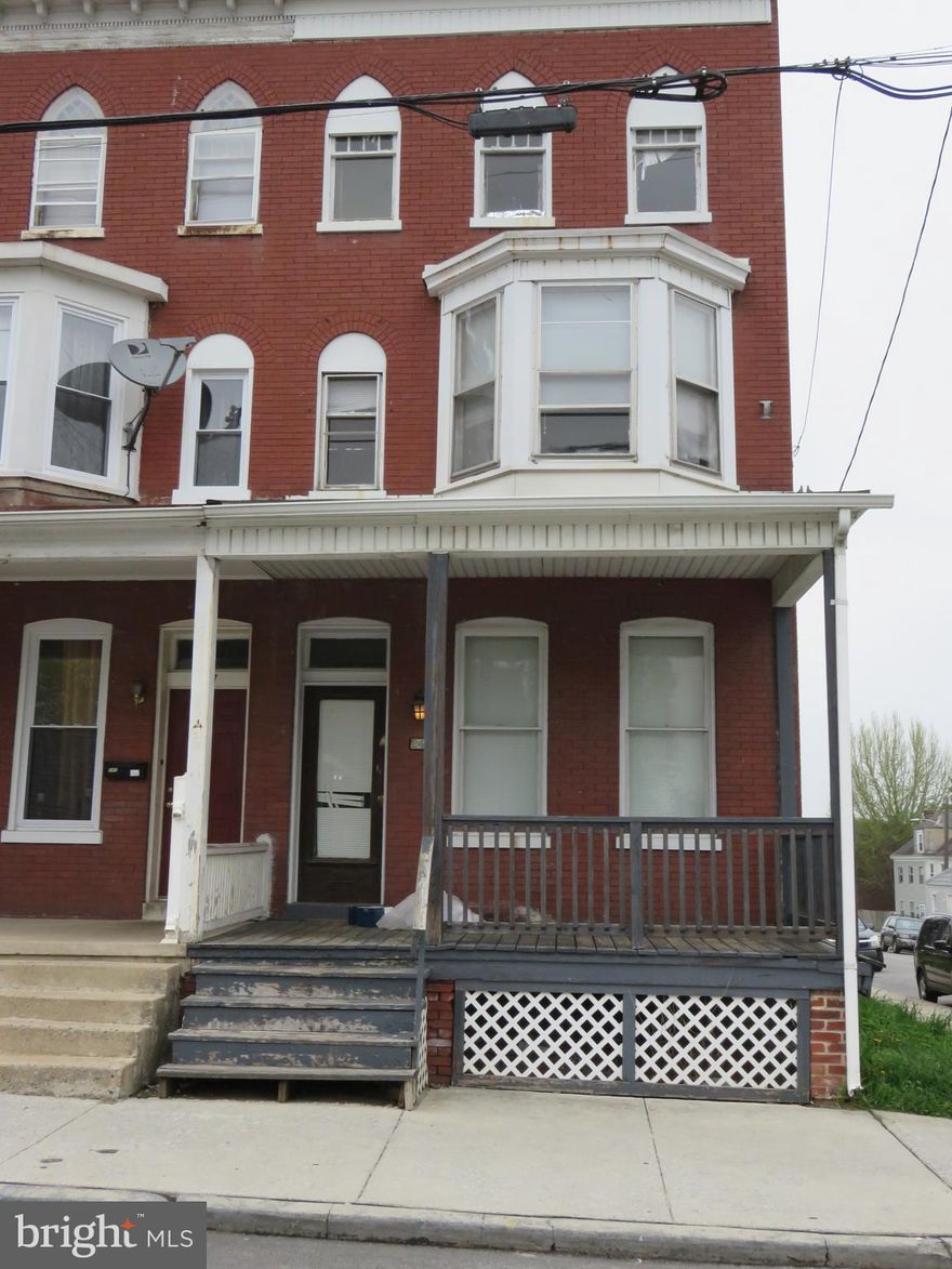 Spacious All Brick End of Row 3 Story Townhouse in Good Condition. 5 Bedrooms-2 Full Baths-Double Living Room. Separate Dining Room. Galley Style Kitchen with Gas Oven/Stove and Refrigerator, has access to Rear covered Deck. Double Living Room has Full Bath (Could be used as a 1st Floor Bedroom ifneeded).  All Bedrooms are spacious.  Large Main Bath on 2 nd Floor. Great Investment or Owner occupied property for the price. Total Taxes are only $1,279.00 Per Year and Last Rented out at $795.00 it wont take long to get return on and return of your Investment. Property is Sold "AS IS" Inspection's are for Buyers own knowledge.