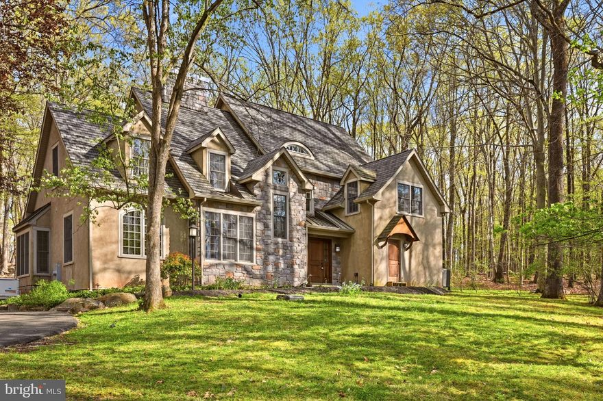 Enjoy a sense of arrival at this custom home perched in a lovely, wooded setting amongst the rolling hills of New Hope. Only a few minutes to the town center for dining, shopping and entertainment; the location offers a rare blend of convenience and total privacy. This home was completely redesigned and rebuilt in 2006, showcasing a more modern, open floor plan and taking advantage of the private nature views from every window. Featuring over 4,300 square feet of space, this 4 bedroom plus bonus loft,  three full and two half bath gem is versatile and spacious yet warm and inviting. Well-maintained and highlighting a New roof in 2022, Newer HVAC, New water heater and whole house generator simply move in and add your personal touches. Cozy up by the wood-burning fireplace in the family room, get the utmost in productivity from an inspiring home office with built-ins or create a homecooked meal in the expansive kitchen. The extensive paver patio and Sunroom are wonderful respites to enjoy the seasons all year long. Additional amenities include a 2 car detached garage with extra storage space, Andersen windows, Ralph Fey design, authentic wood floors, wonderful closet space throughout and New Hope - Solebury schools! Take a trip into New Hope Boro or Lambertville for a meal, coffee or stroll along the river.  Easy commuting access to the Route 202 corridor. Everything is at your fingertips yet once you pull into the driveway you are whisked away to a calmer, more peaceful surrounding.