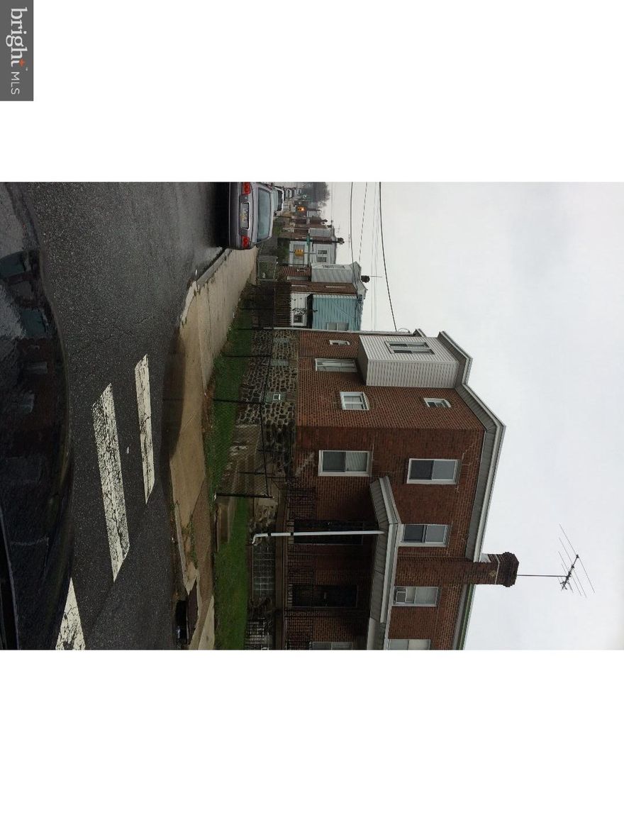 Price drop...2k. End of row 3 bed room home. This nice sized home offers a large unfinished basement. There are hardwood floors throughout the home. There is parking out back and street parking on the side. Kitchen is large and airy. Home has radiators, gas heat, gas hot water. This porch front home has a small side yard. Stack pipe was just replaced and home has beakers. Newer vinyl windows throughout the house. Owner is Pa realtor.
