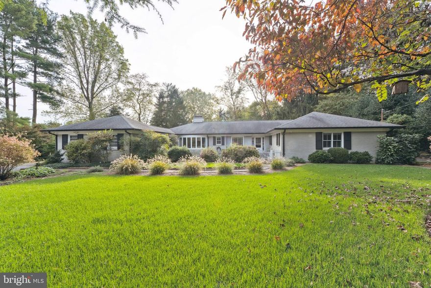 This is a rare opportunity to own one of only 17 homes in Congressional Country Club Estates. Built in 1963, and sited on a 1-acre gardener’s paradise, this home has been lovingly maintained and renovated by its owners over the past twenty-five years. The interior features include custom moldings and built-ins, beautiful oak hardwood floors, a recent upgrade of the master suite and bath, an abundance of closet space throughout the house, and a light-filled, walkout basement with a guest bedroom and bath.

The lawn and gardens are vibrant and inviting from early spring to late fall, with year-round greenery and blooms from every view. The sophisticated variety of perennials, shrubs, and hardwoods, reflecting the influence of a Master Gardener, showcase the beautiful outdoor spaces that transition from formal plantings in the front to a shaded woodland in the rear of the fenced property. The flagstone patio is ideal for large gatherings, the three ponds offer a peaceful habitat for fish and frogs, and the firepit deck is the perfect spot to spend cool evenings in both spring and fall. The outdoor Weber grill is only steps away from the kitchen, and is connected to the home’s natural gas service.

The property’s off-street, gravel parking area can comfortably accommodate three cars. The two-car garage, featuring custom-made barn doors, is currently configured to provide separate spaces for a large workshop and to store a full array of gardening equipment, but it can easily be converted to its original purpose. The garage connects to the main house through a covered breezeway, leading directly into a thoughtfully designed mudroom for easy storage of shoes and outerwear.