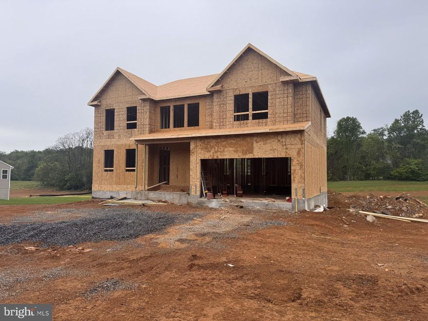 This home is in for under construction and estimated to be completed in August 2026! Welcome to Estates of Tuscarora, a highly sought after community offering 1+ acre homesites within close proximity to commuter routes, shopping, parks, and Historic Downtown Martinsburg! The Canterbury 2-story colonial home located on a homesite #35 on 1.38 Acres. This 2-car garage, 5-bedroom, 4 bath home blends timeless Farmhouse interior design with modern convenience! Offering an open floor plan, this home is perfect for both comfortable living and entertaining. At the heart of the home is an inviting family room with a gas fireplace, seamlessly connected to the kitchen and casual dining area. The well-appointed gourmet kitchen features GE Profile Stainless Steel appliances with range, hood vent, built-in wall oven and microwave; complete with a spacious island with quartz countertops and a farmhouse sink. A finishing touch on the main level is a rare find – an extra bedroom and full bath on the main level, ideal for guests, in-laws, or a home office. The 2-story foyer leads to a boxed oak staircase with an open railing, creating an elegant focal point leading to the upper level. The upstairs includes a loft area, 3 secondary bedrooms, laundry room and spacious Primary Bedroom. The Primary Bedroom includes a walk-in closet, tray ceiling, and luxury bath with a frameless shower door and free-standing soaking tub.  The additional finished recreation room and full bath in the basement complete this home for a total of 3.475 SF on a walk out homesite backing to trees. Don’t miss the opportunity to make this remarkable home your own! Call and schedule your personalized appointment today! Ask about our closing cost assistance with the use of KHovnanian American Mortgage! **Photos are of the decorated Canterbury Model Home and/similar home/features and may not reflect current home finishes. Pricing, options, and promotions are subject to change without notice. See Sales Consultant for more information**