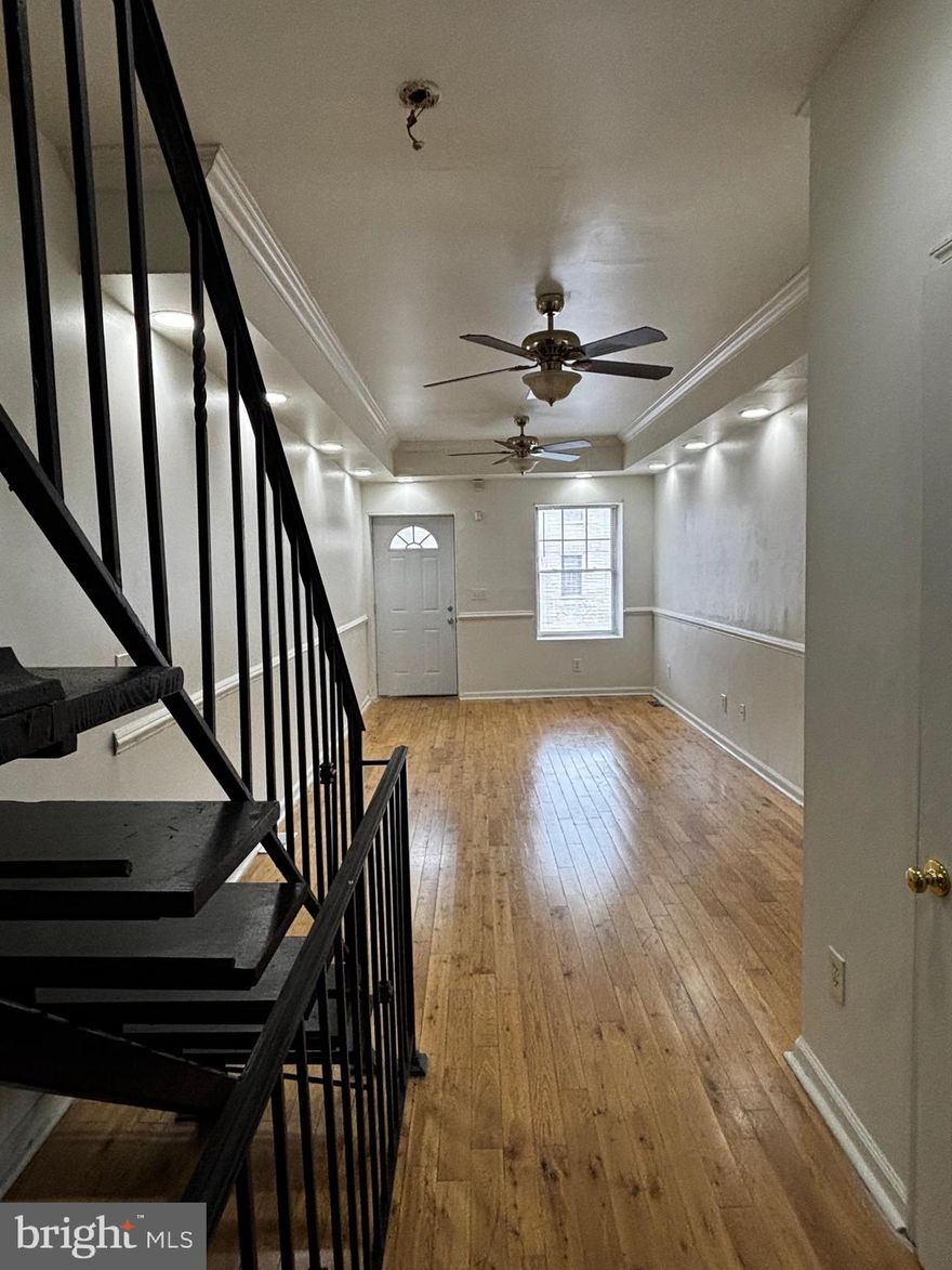 Step inside this hidden gem brimming with possibilities. The open floor plan flows effortlessly across gleaming hardwood floors, accented by elegant iron railings that add a touch of sophistication. The renovated kitchen is a chef’s delight, featuring granite countertops, rich oak cabinetry, and stainless steel appliances.
Upstairs, you’ll find two generously sized bedrooms and two full baths. One bedroom opens to a private rooftop deck—perfect for soaking in panoramic views or enjoying cozy evenings under the stars.
The lower level is a blank canvas for your imagination—create a home office, media room, or fitness space. This property isn’t just a house; it’s an opportunity waiting for the perfect family to make it their own.