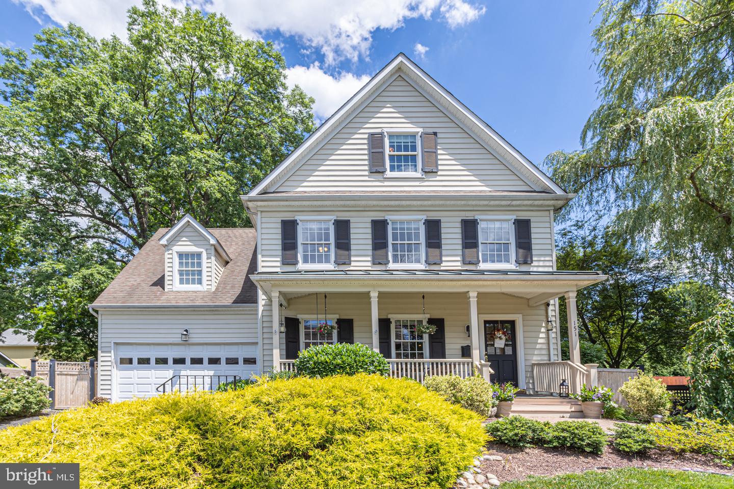 Everything you can possibly hope for in beautiful historic Newtown Borough. Updated, well-maintained, sizeable yard and wonderfully spacious, this 3-story custom built colonial is truly move-in ready – all you have to do is unpack! Follow a paver walkway leading to an inviting covered front porch adorned with a comfy porch swing, the perfect place to unwind with morning coffee or an after-work beverage. Feel the warmth of this home as you step into the foyer with gliding wood plank flooring, neutral color palette and craftsman styled moldings. Admire the wainscoted draped formal dining room with its eye-catching tray ceiling and crown molding. Just down the hall is the cozy great room boasting a floor-to-ceiling stone fireplace nestled between windows and opening to the gourmet kitchen with granite counters, GE Profile appliances and a large center island. The kitchen’s adjacent breakfast area overlooks the landscaped rear yard which provides a private, fenced area along with several entertainment spaces including a maintenance-free deck stepping down to an expansive paver patio with stone wall accents and a wood plank walkway leading to a separate circular space with chiminea for those chilly evenings. An oversized mud room and half bath complete the first floor. Upstairs on the second floor, you are greeted by a large sitting area with endless possibilities. The spacious primary suite has two ample walk-in closets and a newly remodeled private bath with a stylish barn door entry, free standing tub, beautifully tiled walk-in shower and two separate vanities. Two additional sizeable bedrooms on this level share a large full hall bath. A convenient laundry room, with built-in cabinetry can also be found on this level. The third floor hosts two bonus rooms and a full bath, perfect for an au pair, in-law suite or guests. The lower level offers additional living space with its generous family/media area and bar, game space, fitness room, full bath and plenty of storage. Additional home amenities include a 2-car garage and sprinkler system. Just a short walk to the center of town for shopping, entertainment and dining and ideally located in the award-winning Council Rock School District. Make this your new home today!