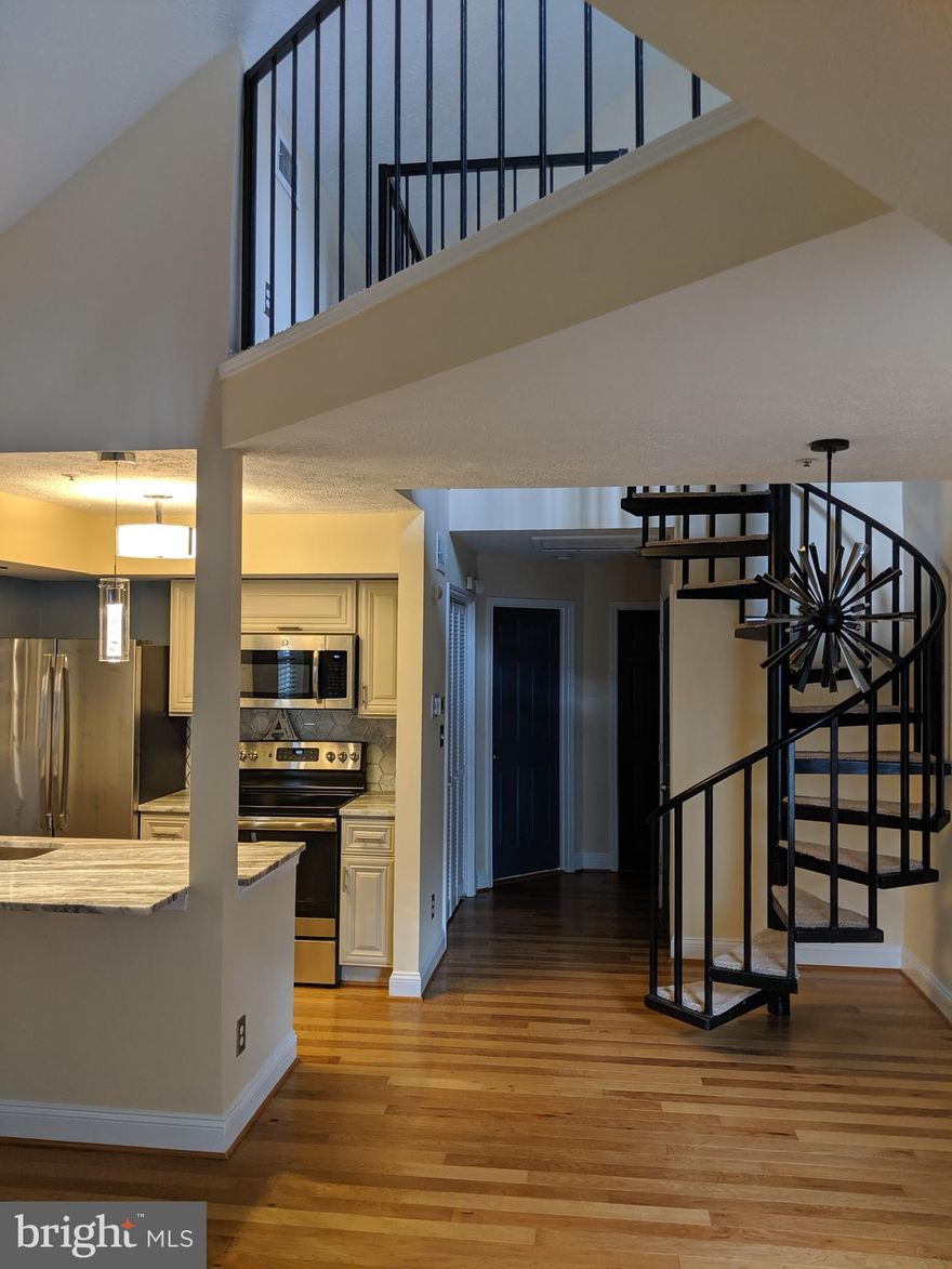 BEAUTIFUL 1 bedroom loft top level condo! Newly renovated in 2019. Stainless steel appliances, upgraded cabinets, exotic European granite countertops, upgraded lighting throughout, upgraded bathroom with ceramic tile and hardwood floors. The large living/dining room features a vaulted ceiling, wood burning fireplace, built in shelving, and a spacious balcony with storage. Bright master bedroom has a walk-in closet. Washer and dryer inside the unit. Open parking. Near Main Street of Upper Marlboro, short commute to Andrews and Bowling Airfoce Military Bases.