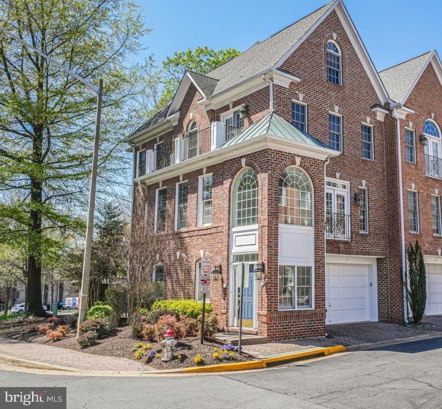 Welcome to 1334 Lessard Ln, a four-level brick end-unit townhouse with a private elevator and two-car garage, nestled in the heart of McLean. This sophisticated home boasts 3 bedrooms, 2 full bathrooms, and 2 half bathrooms, offering luxurious comfort and modern convenience.  

Step through the grand entryway, where oversized windows flood the space with natural light, and stunning black-and-white tiled flooring sets the stage for elegance. The ground level offers a versatile recreation room with a wet bar and direct patio access, perfect for entertaining, plus a convenient half bath and garage entry.  

The main level features an inviting open-concept living and dining area with rich hardwood flooring, tall ceilings, and abundant natural light. A gourmet kitchen is the heart of the home, equipped with white cabinetry, granite countertops, stainless steel appliances, a six-burner gas cooktop, double oven, built-in microwave, and dishwasher. A spacious breakfast nook adds to the charm. The living room features a gas fireplace and access to a private balcony.  

Retreat to the primary suite on the third level, complete with a private balcony, two walk-in closets, and a spa-like en-suite bathroom featuring a dual vanity, soaking tub, separate stall shower, and linen closet. The top level offers two spacious bedrooms, a shared full bathroom, and a convenient laundry room.  

Situated in the sought-after McLean Crest  community, this home provides easy access to public transportation, including Metro and major commuter routes. Enjoy the best of McLean’s shopping and dining, with Tysons Corner, Capital One Hall, and an array of fine restaurants and boutiques just minutes away. Parks, trails, and cultural activities are at your fingertips, offering an ideal blend of suburban tranquility and urban convenience.