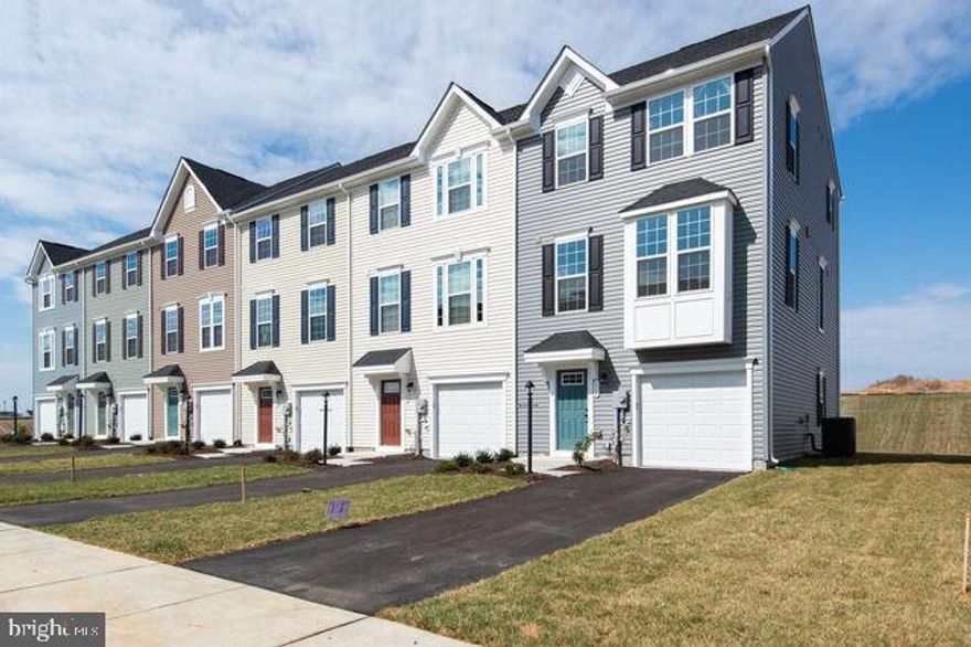 Come see this IMMEDIATE DELIVERY END UNIT Mozart at Cardinal Pointe!  Located in a beautiful community, with mountainous views, a tot-lot and walking trails and gathering pavilion! The Mozart is one of the most popular plans, with modern open-concept living at an affordable price. On the main level, you'll enjoy a bright and airy kitchen with an oversized island with granite countertops, stainless steel appliances, plenty of cabinets and a pantry for storage which opens to the great room- perfect for entertaining. This home has an upgraded kitchen, upgraded flooring, an included deck, and much more! Upstairs are 3 bedrooms, including the owner's suite with a tray ceiling, walk-in closet and bath with dual vanities, and an oversized shower with dual showerheads. Enjoy the extra space for entertaining included finished basement rec room and a rough in for a future powder room! USDA/VA financing available! At Cardinal Pointe Townhomes you'll be just 5 minutes from I-81, 10 minutes to Rt. 70! Making it an ideal commuter location within 40 minutes to Frederick, less than 49 miles to Gaithersburg and 20 minutes to Winchester!
 Come and visit at: 96 Absolution Drive, Hedgesville, WV 25427