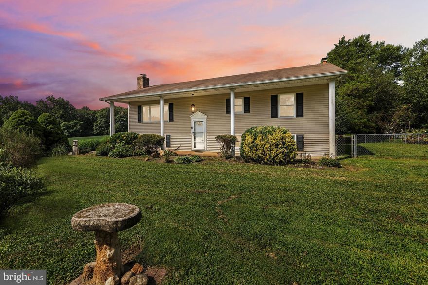 Spacious 4-Bedroom Home on Nearly 2 Acres! Situated in the Heffner community of Reisterstown, this 4-bedroom, 3-bath split-level home offers 1,944 square feet of finished living space on a private 1.85-acre lot. This property provides an excellent opportunity for those looking to update and customize a home to fit their vision. The main level features a traditional layout with hardwood floors in the living area, an eat-in country kitchen with an island, and three bedrooms, including a primary suite with an attached bath. The finished lower level adds additional living space with a family room, fireplace, wet bar, an extra bedroom, and a full bath. Outside, you’ll find a detached 2-car garage, ample driveway parking, and a fenced backyard surrounded by trees and open space. Home is being sold strictly as-is and offers plenty of potential for buyers ready to bring their ideas to life.