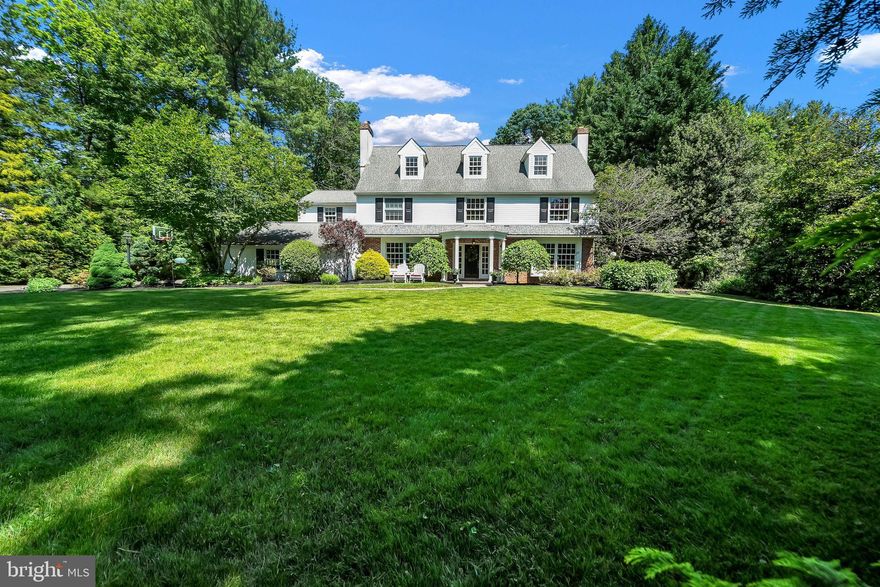 Wayne's Perfect Blend: Comfort, Privacy, and Location. 

Immerse yourself in comfort and luxury in this stunning 5-bedroom, 4.5-bathroom custom colonial estate, nestled on an acre of land in sought-after Wayne, PA. Perfect for entertaining, the expansive first floor boasts a semi-open floor plan, featuring a chef's dream kitchen redesigned by Joe Chicco in 2014. The kitchen showcases a large island with built-in storage, a breakfast area with breathtaking views of the backyard, and an elegant cathedral ceiling, all accompanied by heated floors. Create a warm and inviting atmosphere for friends with two cozy dens and a large formal dining room, each featuring its own wood-burning fireplace. Upstairs, a light-filled haven awaits. The great room features a vaulted ceiling and a dramatic atrium window overlooking the meticulously landscaped backyard and the two-tiered brick and stone patio, ideal for hosting memorable gatherings. The luxurious main bedroom is complete with cathedral ceilings, a walk-through closet leading to a private bathroom, and wonderful views. Two additional bedrooms, one with an ensuite, and a hallway bathroom complete the second floor. A versatile third floor offers a bathroom and two more bedrooms, with the option to convert one into a perfect home office. This space is perfect for teenagers, guests, or a dedicated creative space.

This exceptional property is located in historic Wayne, PA, placing you in the heart of the charming Main Line. Enjoy the convenience of being in close proximity of everything you need: churches, preschools, the Mill Dam Swim Club, Wayne Elementary School, a network of paved and unpaved walking trails, and the Wayne Art Center.  Step outside to your private backyard oasis surrounded by a wooded backdrop, perfect for outdoor parties or relaxing under the stars. Across the street is Dittmar Park, a verdant escape just a few steps away, offering a serene natural environment to relax and connect with nature. This custom-built home offers the perfect blend of comfort, privacy, and an abundance of natural light. Create lasting memories in this inviting space. Listing Agent is related to seller.