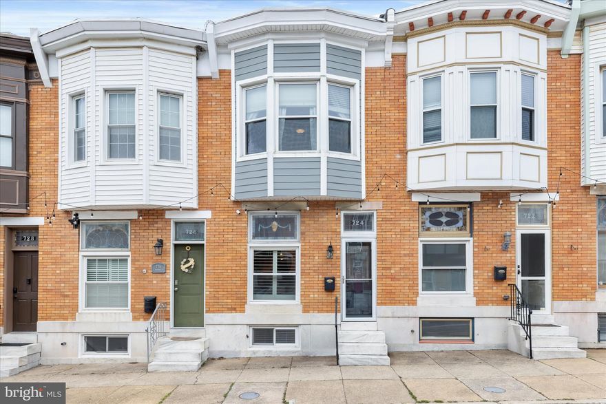 If you have been searching for the perfect rowhome in the sought-after Canton neighborhood, this beautifully renovated 3-bedroom, 2-bath brick home delivers a rare combination of style, function, and unique features.
A welcoming vestibule entry opens to a light-filled living room enhanced by hardwood flooring, crown molding, refined millwork, and an exposed brick accent wall. The space flows seamlessly into the dining area, where matching finishes and a statement light fixture create a cohesive blend of classic charm and modern design.
The kitchen is both stylish and practical, offering stainless steel appliances, granite countertops, display cabinetry, recessed lighting, and gas cooking. Just beyond, a thoughtfully designed serving alcove features custom built-ins, a striking exposed brick backdrop, and pendant lighting that adds warmth and character.
One of the standout features of this home is the main level sitting room, a flexible space with custom built-ins that can easily function as a cozy family room. From here, step out to a petite deck that is perfect for grilling.
Upstairs, the primary bedroom offers an inviting retreat with double French door entry, hardwood flooring, crown molding, and abundant natural light from a charming bay window. A spacious walk-in closet with an organization system adds everyday convenience and is a rare find in a rowhome. The updated full bath features a double sink vanity with ample storage, modern lighting, and a frameless glass shower with ceramic tile surround and a built-in bench.
The second bedroom continues the home’s refined style and provides access to a deck with a staircase leading to an impressive rooftop deck complete with a pergola and sweeping city views.
The finished lower level adds even more versatility with several standout features. A bonus room offers the perfect space for a home office or gym and includes walkout access to the private parking pad. This level also includes a tastefully updated full bath, a well-designed laundry area, and a bright third bedroom with custom built-in storage and sliding barn doors.
Additional updates include a new HVAC system installed in 2025, a water heater replaced in 2026, a recently sealed exterior in 2025, and a freshly repainted roof deck in 2026. With its thoughtful renovations, flexible living spaces, and prime Canton location, this home truly stands apart.



Ground rent and Cap Value to be confirmed with title.