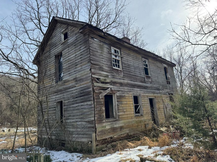 OFFERS DUE SUNDAY BY NOON.  SELLER RESERVES THE RIGHT TO ACCEPT OFFERS BEFORE THE DEADLINE.  The value is in the land here.  Secluded 2.5-acre property in a peaceful country setting, featuring a partially wooded lot. The existing Chestnut log home offers potential for renovation or removal. A spacious barn is located toward the rear of the property and also needs renovation or removal. Well and septic systems are already installed so this land is ready for your dream home. Please use MR forms for settlement in Washington County.  ENTER THE BUILDINGS AT YOUR OWN RISK.  MAY NOT BE STABLE (ESPECIALLY THE BARN). Located near Antietam Battlefield. Property is being sold AS IS.