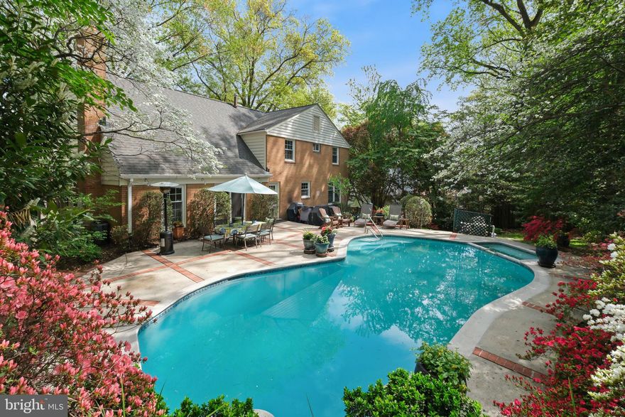 Experience the perfect blend of modern upgrades and classic comfort in this meticulously maintained residence featuring five versatile bedrooms and two and a half baths.

The main level welcomes you with gleaming hardwood floors that flow seamlessly through an expansive formal living room and grand dining room, offering ample space for both quiet relaxation and larger gatherings. An inviting family room sits just off the kitchen, anchored by a cozy wood-burning fireplace. At the heart of the home, the updated eat-in kitchen features sleek stainless steel appliances, recessed lighting, a dedicated pantry, and a built-in wine fridge for effortless entertaining. This level is completed by a convenient half bath and a flexible main-level bedroom, ideal for guests or a home office.

Indoor-outdoor living flows seamlessly, with new sliding glass doors opening to a private backyard oasis. This fully fenced retreat is framed by lush greenery and vibrant blooms, creating a serene backdrop. A heated pool and spa with a built-in hot tub anchor the space, offering a true resort-style setting for both entertaining and everyday enjoyment.

Upstairs, the expansive primary suite features a unique layout with an attached room, currently styled as a custom walk-in closet, that is easily convertible to a nursery or an additional bedroom. Three additional bedrooms share an updated hall bath with double vanities and modern finishes. The finished lower level provides generous additional living space with durable LVP flooring, a practical kitchenette, a dedicated workroom, and a large laundry area with storage.

Superior peace of mind is ensured with extensive recent exterior and interior updates, including a newer roof, siding, HVAC, garage door, and energy-efficient windows. Complete with a one-car garage and set in a sought-after neighborhood, this home is truly move-in ready.

This home is moments from Tilden Woods Park, Tilden Woods Pool, and North Farm Pool. Commuters will appreciate the rapid access to I-270, I-495, and the North Bethesda Metro Station. With Pike & Rose, Montgomery Mall, and the Strathmore Music Center just minutes away, premier dining, shopping, and entertainment are always close at hand.