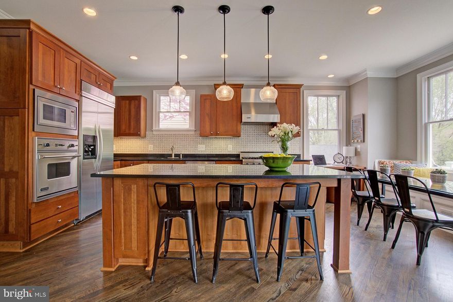 Have a WOW experience and fall in love with this North Arlington beauty new to the market! You will enjoy over 4,200sf of bright and light living space with three beautiful levels on a lot that is almost a fifth of an acre. For entertaining possibilities, you'll find a wonderful, open main floor leading to a new deck and a large, flat fully-landscaped yard. Everyday comfort and convenience is built into this home as well, with five bedrooms and 4 1/2 baths, three finished floors, lots of large windows, and tons of closets and abundant storage. Additional features that make this home special are a glimmering, gourmet eat-in kitchen, complete with granite counter tops, 42" cabinets, a beautiful basketweave backsplash, double door KitchenAid refrigerator, Viking wall oven, built-in microwave, Viking range and hood, deep sink, counter dining and an expansive window seat with table area. Off the kitchen, you'll find a huge walk-in pantry and even a butler's pantry, complete with sink, glass storage and cabinets, and just off of the private dining room. On the lower level, you will be welcomed by yet another gas fireplace, tall ceilings, and  French doors leading to the back yard and a wonderful pergola and dining patio. The creme de la creme of the lower level is a huge media room, complete with projector, wall screen, and surround sound. Additionally, there is lots of room for game playing, and a large storage room. And last, but not least, a convenient and private third master or guest or au pair suite. On the upper floor, you'll be happy to know that there are the ever-desired four bedrooms - and - two have ensuite baths. Three of the bedrooms each have two closets. Huge storage closets grace the second floor landing, as well. The master bedroom has a large sitting area and two huge walk-in closets. Not to be missed is the master bath's claw foot tub, large, separate shower and heated floor. The home has two heating/cooling zones with Nest thermostat. Lastly, you'll find a beautiful driveway, and an oversized two car garage, with extra room for lots of storage, complete with a plug-in for an electric vehicle. All of this for your comfort, enjoyment and ease of living. See special 3D Tour.