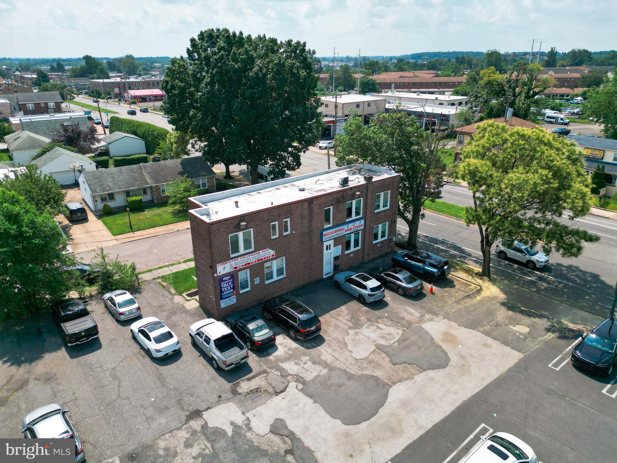 Opportunity knocks with this highly visible corner lot commercial building ideally located in a high traffic area and currently configured for multiple tenants. Boasting great curb appeal and ample off street parking this well maintained property is a smart investment for those looking to generate immediate cash flow or expand their portfolio.
The building is currently divided into three separate units each with its own private entrance making it perfect for multi tenant use. On the first floor you'll find two active storefronts a barbershop and a cell phone store along with a powder room and additional office space ideal for a variety of retail or service businesses.
The second floor is set up as a professional office currently utilized by an accountant. It features a welcoming reception area multiple private offices a kitchenette and two powder rooms making it perfect for law firms consulting agencies medical professionals or any service based business.
Additional features include a partially finished basement that offers even more usable space plus a large unfinished area ideal for storage.
Whether you're an investor looking for a cash generating property with multiple tenants or a business owner seeking a flexible space to occupy and lease this building checks all the boxes