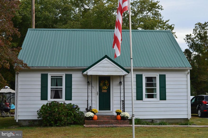 Quaint and cozy best describe this home that has a metal roof, brand new replacement windows, large rear deck and detached garage with workshop that's situated on a large, nearly half acre lot. There are 2 bedrooms on the 1st floor and the 2nd floor is currently being used as a 3rd bedroom.  Fire pit, underground pet containment system with 2 collars and a hardwired 60 gal. air compressor in the garage are also included with the sale. Priced to sell so schedule your showing before it's gone!