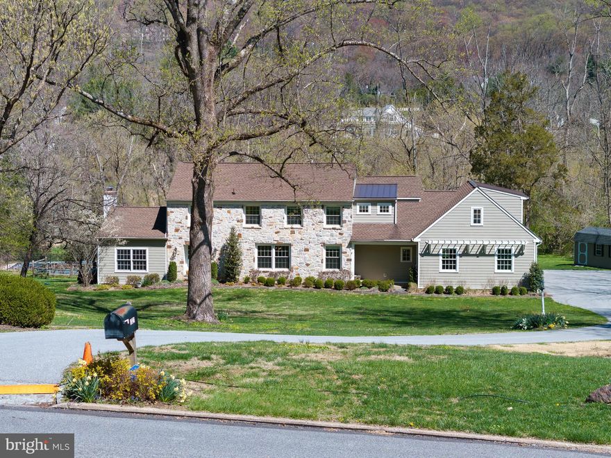 Welcome to this stately and beautifully updated home, nestled on a private 2.6-acre lot at the end of a quiet cul-de-sac in the heart of Malvern. This property offers a true resort-style lifestyle with an expansive, level backyard featuring a meandering creek, in-ground pool, fire pit, playset, chicken coop, and a gardener’s shed—perfect for outdoor living, entertaining, and everyday enjoyment. Step through the double front doors into a welcoming foyer with a classic wrought iron staircase, powder room, and coat closet. To the left, a step-down formal living room centers around a gas fireplace with a marble hearth and offers serene views of the backyard. French doors lead into a sun-filled bonus room, ideal as a home office, playroom, or creative space. To the right of the foyer, the formal dining room boasts chair rail detailing, built-in corner cabinets, and an elegant chandelier. A butler’s pantry connects the dining room to the kitchen, making entertaining seamless. The heart of the home is a custom-designed gourmet kitchen featuring a 10’ x 4’ island, quartz countertops, tile backsplash, and top-tier appliances, including a 6-burner Wolf gas cooktop with double oven, Sub-Zero refrigerator, Sharp built-in microwave, two dishwashers (Bosch and Fisher & Paykel drawer), two sinks, and a Kohler farmhouse sink. Over 30 drawers and extensive cabinetry offer abundant storage. Just off the breakfast area, a TimberTech deck provides the perfect vantage point to take in the peaceful backyard. Also on the main level is a flexible den or guest bedroom, a mudroom with porcelain flooring, and access to a three-car garage. Hardwood floors run throughout the first floor, adding warmth and elegance.Upstairs, you'll find four spacious bedrooms and three full bathrooms, including a luxurious primary suite added in 2016. This serene retreat includes a sitting or workout area, custom walk-in closets, and a spa-like bathroom with heated porcelain floors, a double vanity, a large walk-in shower with triple shower heads (including a new rain head), a private water closet, and ample linen storage. A secondary suite with an updated en-suite bath is perfect for guests, older children, or multigenerational living. A convenient second-floor laundry area completes the level. The finished lower level includes a full bath, egress to the backyard, and flexible space for a gym, media room, or playroom. Additional highlights include two-zone HVAC with a brand new heat pump (2025), propane heating and cooking, a whole-house generator, PEX plumbing, fresh paint throughout, and recent pool updates including new high end tile and coping, as well as completely resurgaced the pool with pebble tech (approx. $30,000). The home’s cement siding and lifetime architectural roof ensure lasting durability and curb appeal.Located just 2.5 miles from the Paoli Train Station with access to SEPTA and Amtrak, and minutes to Routes 202, I-76, and the PA Turnpike, this home offers both tranquility and convenience. Enjoy proximity to charming Malvern Borough, King Street shops and restaurants, People’s Light Theater, and the Chester Valley Trail. This is a rare opportunity to own a thoughtfully updated home in a premier Main Line location—schedule your private showing today.