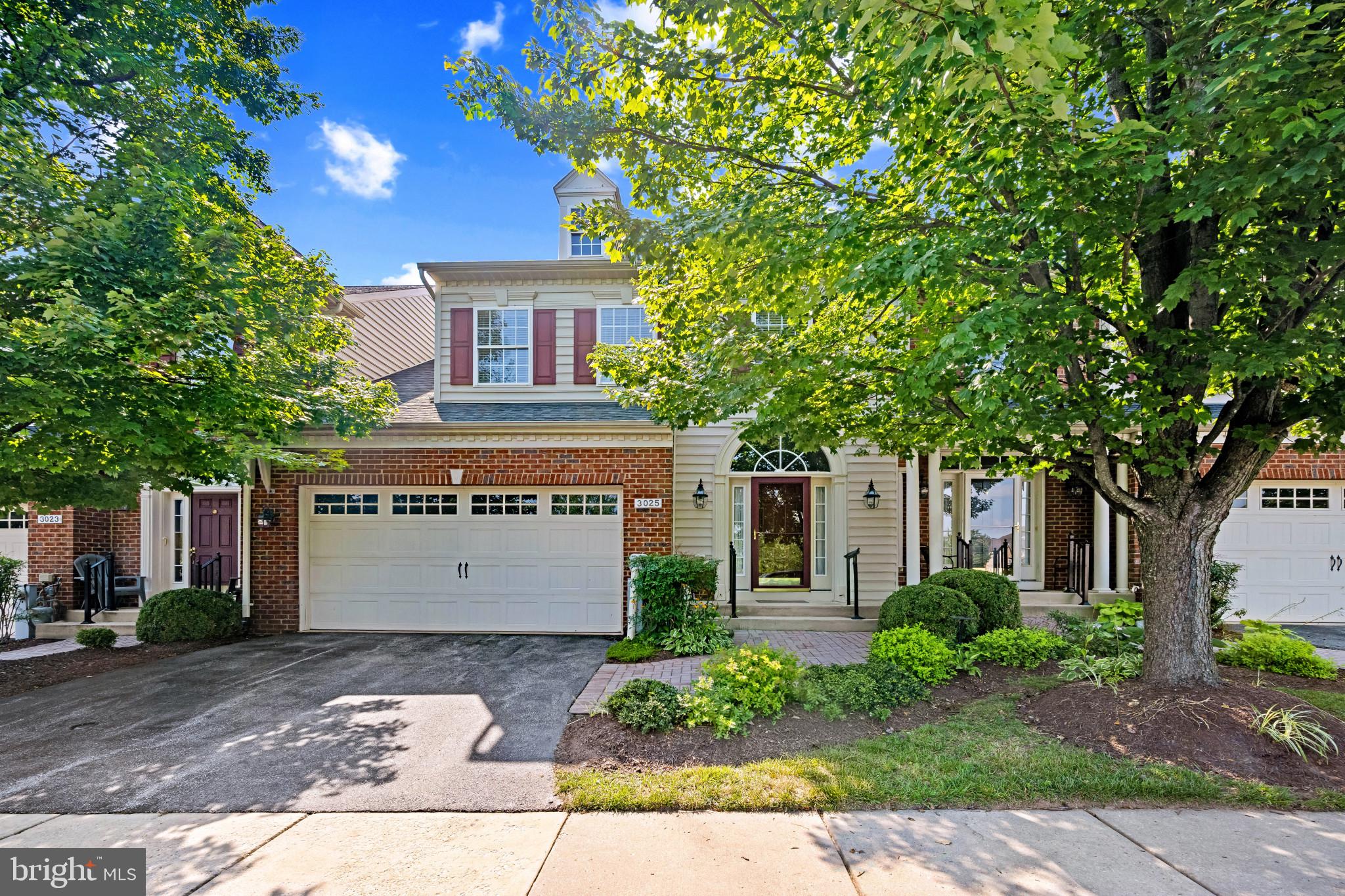 Elegant villa residence offering 2,597 square feet, 3 bedrooms, 2 full bathrooms, 1 half bathroom, and a 2-car garage, nestled in the beautifully maintained 55+ community of Ellicott Meadows. The main level welcomes you with a hardwood foyer that flows effortlessly into the open-concept great room, beginning with the formal dining area and continuing into a spacious living room. Sophisticated columns define the living space, which features plush carpeting, soaring vaulted ceilings, a cozy gas fireplace, and access to the deck with a privacy wall and steps leading down to a lushly landscaped green space. Off the foyer, the eat-in kitchen offers warmth and functionality with rich cabinetry, ample counter space, a center island, sleek black appliances, a warm-toned backsplash, a cozy breakfast room, and a convenient pass-through window with views into the great room. The laundry facilities are also located just off the kitchen for added convenience. Designed for easy single-level living, the main level also includes a generously sized primary suite with a large walk-in closet and an en suite bath complete with dual vanities.Upstairs, a bright loft area leads to a versatile sitting room with a walk-in closet, two additional bedrooms—one featuring an oversized walk-in closet—and a second full bathroom, offering plenty of space for guests or hobbies. The expansive lower level serves as a blank canvas, ready to be finished to suit your lifestyle or used as generous storage space. Residents of Ellicott Meadows enjoy a wealth of amenities, including a clubhouse, fitness center, scenic paths, meeting and party rooms, a community pool, and tennis courts, offering an active and engaging lifestyle.