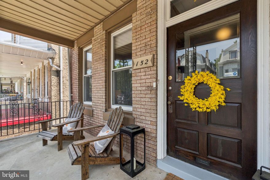 Discover this charming and spacious porchfront twin home nestled on a quiet, tree-lined block in West Mt. Airy—just steps from the shops, cafés, and charm of historic Germantown Avenue. Enjoy lazy summer afternoons in the Adirondack chairs on the front porch, watching the friendly neighborhood go by. Step through double doors into a Majolica tile-lined vestibule, and enter a bright, open living room featuring 9-foot plus ceilings, original hardwood floors, crown molding, and an exposed brick accent wall. Original woodwork and trim throughout the home add timeless character and warmth. A square archway leads to the large dining room and open-concept kitchen—an ideal layout for both entertaining and everyday living. The dining room is highlighted by a modern ironwork chandelier that beautifully blends old and new. The kitchen boasts chestnut cabinetry, sleek black countertops, crisp white subway tile backsplash, and large-format floor tiles. A breakfast island offers the perfect spot for morning coffee, and stainless steel appliances complete the chef-friendly setup. At the rear of the home, a convenient powder room and a mudroom with vintage-style hex tile flooring transition seamlessly to the expansive backyard. The flagstone-paved outdoor space features warm cedar fencing and a handsome pergola—perfect for al fresco dining, grilling, or container gardening. Upstairs, the primary bedroom sits at the front of the house with a lovely bay window overlooking the street, hardwood floors, and two spacious closets. The main hallway bath features limestone tile, a tub/shower combo, and abundant built-in shelving for organized storage. Two additional bedrooms with fully outfitted closets complete this level. The third floor offers exceptional flexibility, with three more rooms: a large family room or den at the front, two additional bedrooms (one currently used as a home office), and a three-piece bath with a tiled floor and limestone stall shower. The full basement includes a spacious laundry area directly below the kitchen, plus ample storage space and updated mechanicals. Modern-style windows throughout the home ensure efficiency and ease of use. Located on a fantastic block in Mt. Airy, in the highly sought-after Charles W. Henry School catchment, and just minutes from neighborhood favorites like The Frosted Fox, Malelani Café, DOHO Taqueria, and Weavers Way Co-op. Nearby outdoor destinations include Wissahickon Creek and trails, several parks, and the Awbury Arboretum. The Chestnut Hill West regional rail line (Upsal Station) is just an 8-minute walk away, providing quick access to Center City. This is a wonderful opportunity to own a beautifully maintained home in one of Philadelphia’s most beloved neighborhoods. Schedule your showing today!