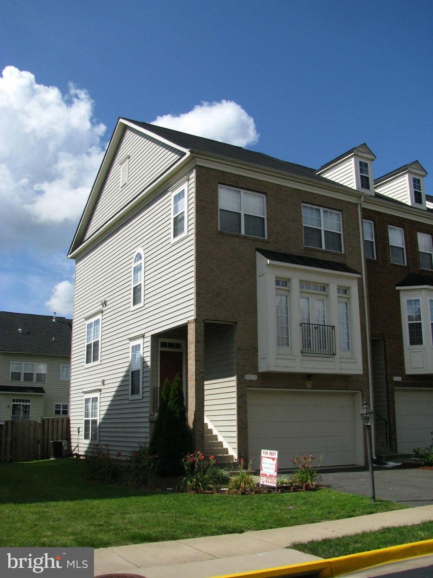 Beautiful brick End unit townhome with all the bells and whistles. New carpet Deluxe kit with 42" maple cabinets & granite. Large master suite with sep shower and garden tub. Familyroom and 1/2 bath in basement. 2 car garage. Close to I-95, Quantico and Ft. Belvoir.  Sorry no smoking or pets.  Good credit a must. Community pool & tennis and tot lots. New patio and fenced yard.