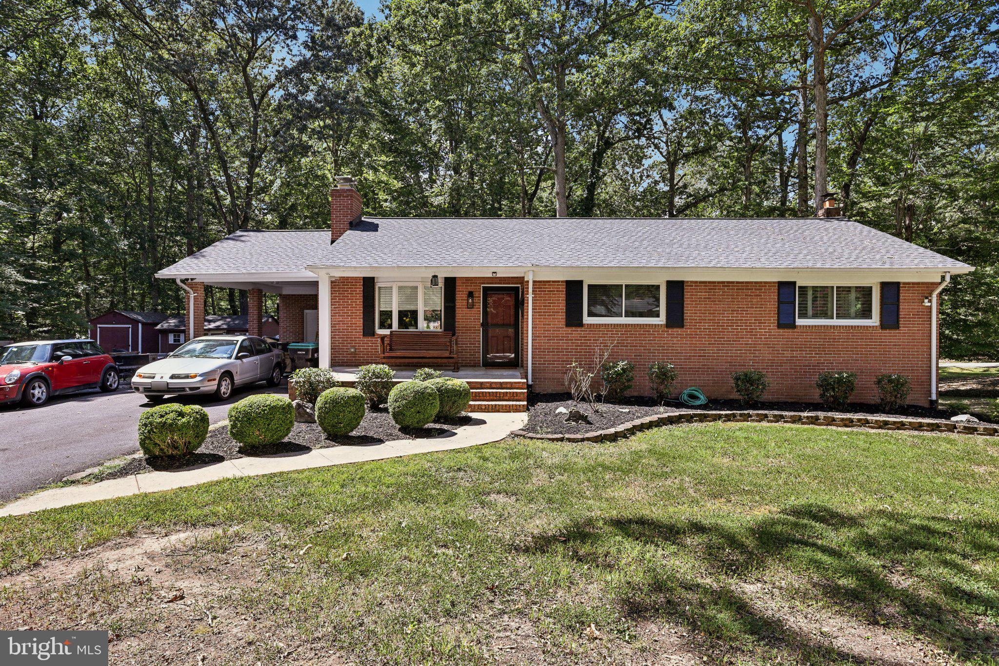 MOTIVATED SELLER!!! 1 year home warranty included. Credit available with full price offer. Contact Agent for details. A true La Plata gem awaits! This stunning all-brick rambler offers the perfect combination of classic style and modern functionality. Home features 3 bedrooms and 3 full baths over two levels. Parking is a breeze with expanded driveway and a covered carport. Located on a quiet corner lot of over an acre with no HOA.
Step inside to a beautifully updated interior with new flooring and paint, creating a bright and welcoming atmosphere. The main level features a cozy living room with a fireplace, a gourmet kitchen with new stainless-steel appliances, and a massive owner's suite complete with a private bathroom and spacious walk-in closet. An additional sunlit bedroom and hallway full baths are also on the main level.
The fully finished basement is a standout feature, offering incredible versatility. With its own private, separate entrance, it's perfect for a private in-law suite, a guest apartment, or even a potential rental unit for additional income. The basement includes a spacious second living room with a fireplace, a full bedroom, and a full bath, providing an independent and comfortable living space. This level also includes laundry room with additional storage
The wrap around yard provides endless opportunities for gardening, entertaining, or simply enjoying the peaceful surroundings. This is a rare opportunity to own a meticulously updated home with the added benefit of a separate, functional living space. Schedule your tour today!