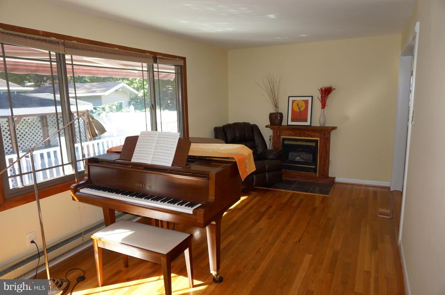 Beautiful fenced corner lot. Spacious main level with hardwood throughout. 4 bedrooms incl Master Suite w/full bath.Updated kitchen with Corian countertops, b'kfast bar. Spacious sunroom. Fenced yard w/ two-tiered Trex deck, patio,gazebo and hot tub. Finished basement w/ loads of storage space. Walk to shopping/restaurants/bus and Matt Henson St. Park. 5 min drive to Metro.Open Sun.11/30 from 1-4