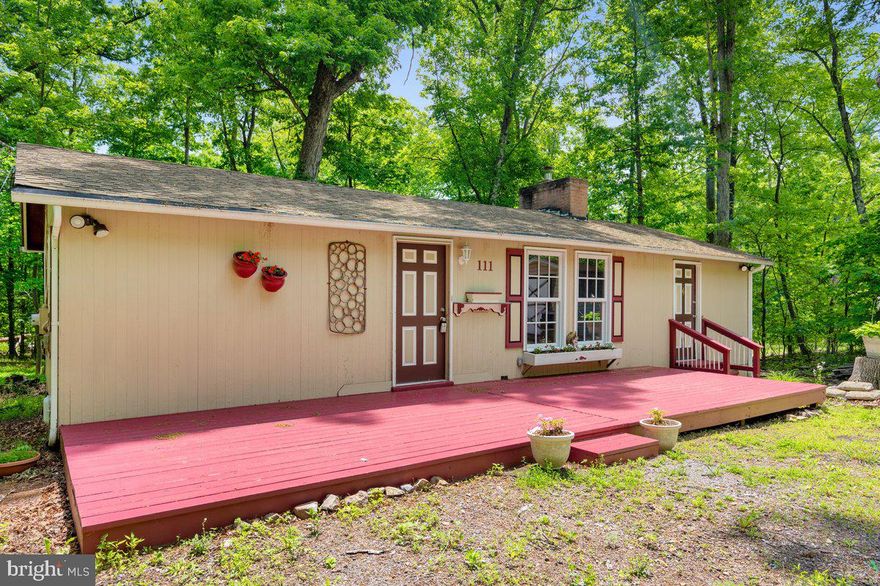 Remodeled rancher on 4 lots totaling 1.41 acres. Cute 2 bedroom 1 bath home freshly painted with new luxury vinyl planking throughout the entire house. Brand new bathroom with tub /shower.  Open floor plan with bedrooms on each end of the house for privacy.  2 sheds that convey to store whatever your heart desires.  Come out and and enjoy all the open space! Go fishing ,play on the playground, kick a soccer ball on the large grass area.  Shawnee Land is in a sanitary district , fee is paid annually with taxes.