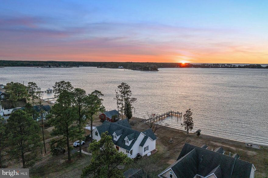 Escape to tranquility at this Cape Cod-style home, perfectly positioned on the shores of Fishing Creek—an idyllic tributary off the Little Choptank River. With breathtaking west-facing views, this well-maintained home offers the perfect setting for both relaxation and adventure.
Enjoy unobstructed panoramic water views and sunsets from multiple vantage points—whether you're lounging on your screened-in porch, strolling along your 150 feet of private sandy beach, or fishing from your new 100-foot pier. For boaters, the pier offers water depths of 4 feet at low tide.
Inside, the great room features a cathedral ceiling and an open-concept layout that seamlessly blends the kitchen, dining, and living areas, all with stunning views of the water. Glass doors lead directly to the screened-in porch, ideal for entertaining or simply soaking in the peaceful surroundings.
The first-floor primary suite offers uninterrupted views of the bay, a spacious en-suite bath with a jetted tub, double vanity, and walk-in shower. Three additional bedrooms, each with built-in closets, share a full bath on the main floor. Upstairs, a large bonus room—perfect for an office, family room, or extra sleeping space offers even more flexibility, along with another full bathroom. There is also potential to expand in the large attic for additional living space.
Storage is never an issue with an oversized two-car garage, plus a detached one-car garage for hobbies or a workshop.
This home is just 20 minutes from downtown Cambridge.  Whether you're seeking a year-round sanctuary or a seasonal escape, this waterfront gem is move-in ready and waiting for you to make it your own.