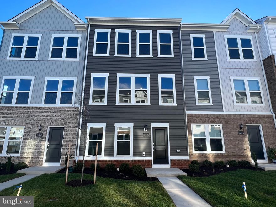 **Brand new 3 bedroom, 3 1/2 bath luxury townhome!**Be the First to Live in this new townhome in charming downtown Haymarket in Crossroads Village.  Walk to local grocery, shops, restaurants and much more.  This Beautiful New Townhome Features a Two Car Garage.  1980 Finished SQFT.  Modern open floorplan with 9’ ceilings on all three levels. Gourmet kitchen with gas cooking, stainless steel appliances, and quartz countertops. Extended island perfect for entertaining. Large pantry.  Dining area off kitchen.  LVP flooring on kitchen/living level.  Laundry room located on bedroom level with new washer and dryer. Full bathroom located on the lower level.  Window blinds have been Installed throughout.  Large Trex deck. Minutes to major commuter routes 29, 66, 15, Commuter Lot, and under 30 minutes to Dulles International Airport.