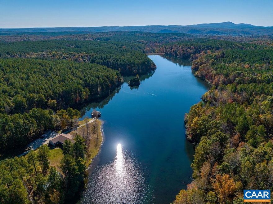 Absolutely private and pristine deep water lake  of 50+/- acres, with (2) miles of shoreline, in Nelson County, surrounded by nearly 800 acres of commercial pine forest, designed for staggered harvests into perpetuity. An incredibly rare recreational paradise. A new lake home, with quality appointments at waters edge,  a boat house with (2) lifts and a large steel storage building to house toys and equipment. Internet and generator are in place. Nearly 7 miles of interior roads and trails with mountain views. Includes access to nearby James River!,Cherry Cabinets,Granite Counter,Fireplace in Great Room