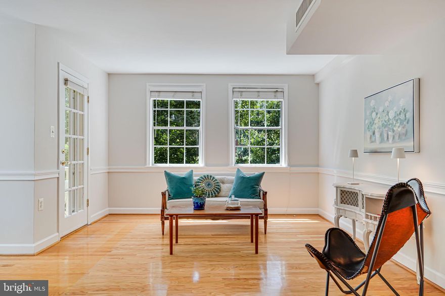 This is the special  Belle View condo you've been waiting for!  SECOND floor PORCH unit with beautiful hardwood floors and updated bathroom.  Freshly painted throughout. An excellent location in fantastic Belle View.  Walk to everything; shopping, restaurants library, the fabulous newly restored Fairfax Co. recreation center and the GW path!  Belle View is always a very desirable community in a garden-type  setting with beautiful trees and plantings.  This rare and spacious unit has windows on four sides and overlooks a peaceful green space.   Spacious closets plus an extra private, locked storage unit in the basement.  Parking in the lot just outside the building is extremely convenient.