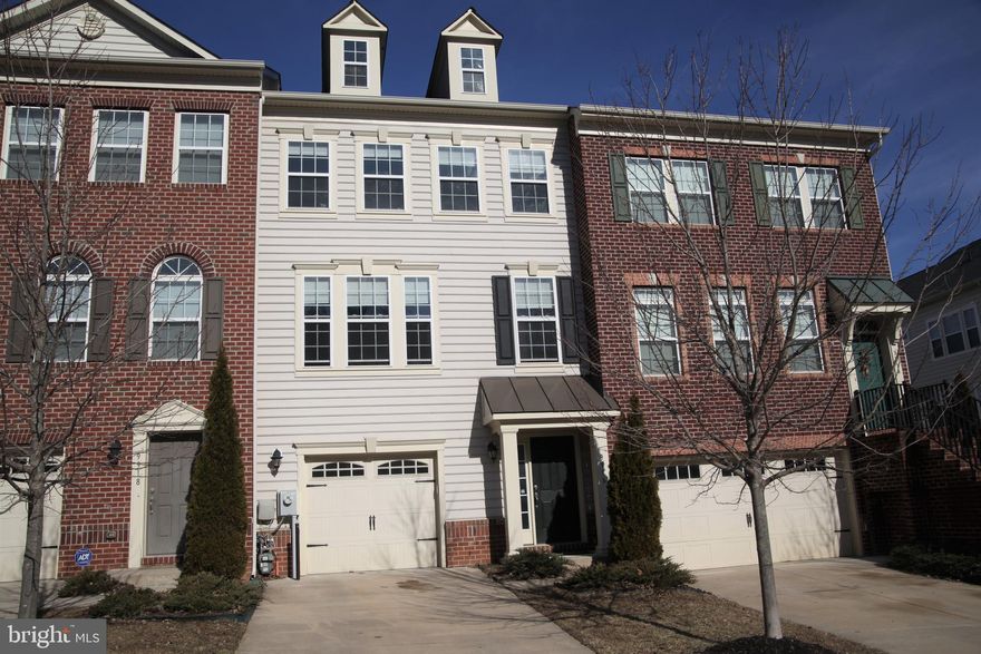 Bright garage townhouse. Excellent condition. Open floor plan. 4 bedrooms and 3.5 bathrooms. Great kitchen with 42" maple cabinets, stainless appliances. 9'ceiling. Separate Laundry Room on Bedroom Level. Large deck with good view. Beautiful community with playground, tennis count and swimming. Convenient location. Close to 95. Current tenant would leave some furniture if protentional tenant is interested.