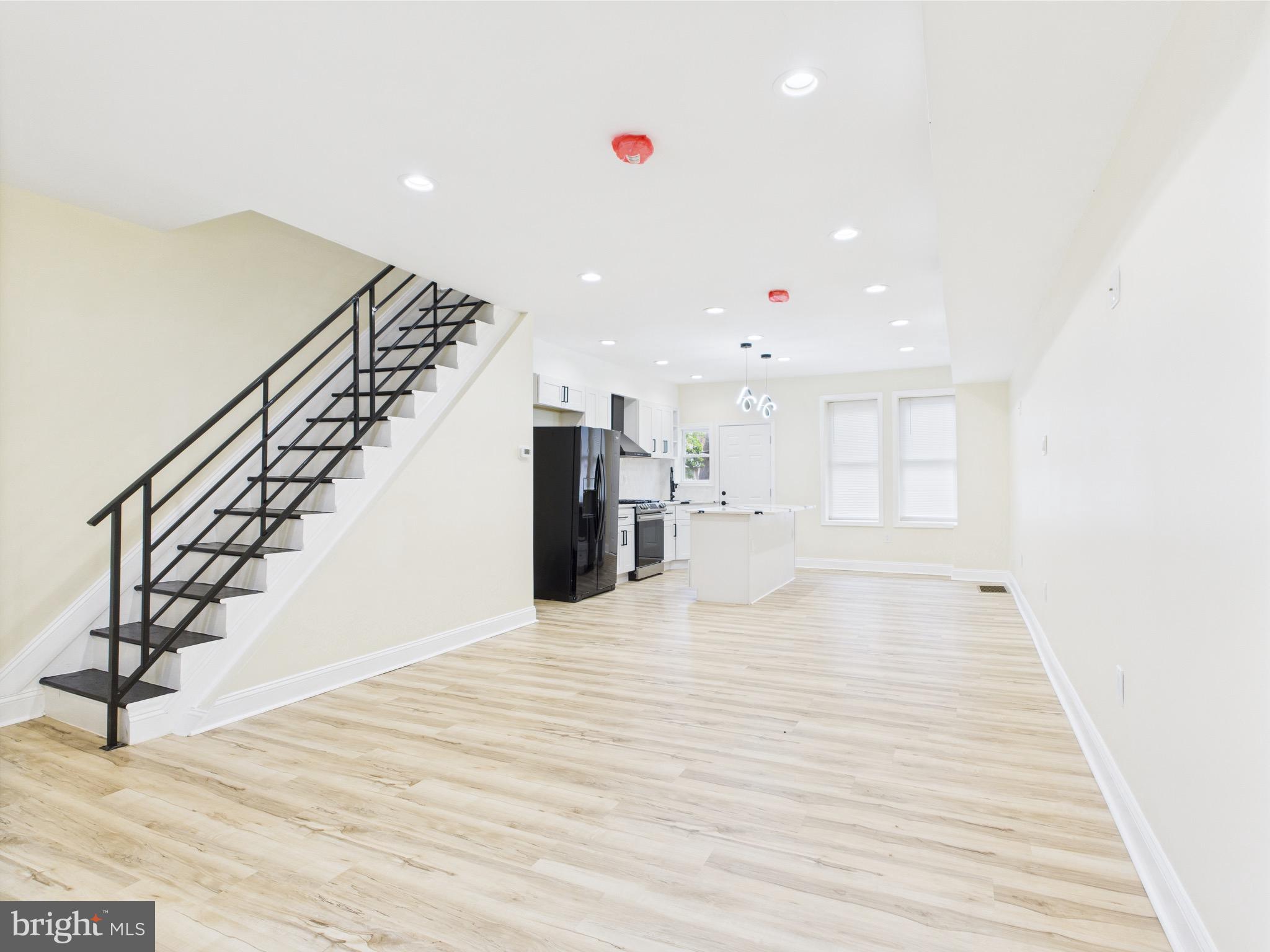 Experience this beautiful renovated 3-bedroom, 1.5-bath home, located in the vibrant and convenient Olney section. This rare gem is boasting premium finishes, thoughtful design, and modern elegance throughout.
Flooded with natural light and enhanced by recessed LED lighting, the open-concept interior offers the perfect blend of sophistication and functionality. The kitchen is a true centerpiece, featuring all-new stainless steel appliances, a motion-sensor hood range, LED kitchen faucet, marble backsplash, and top-of-the-line quartz countertops, including a striking island crowned with sleek over-island LED lighting—ideal for both daily living and stylish entertaining.
The full bathroom is a contemporary retreat with a large LED vanity mirror and a water-saving dual-flush toilet. The half bath continues the modern aesthetic with matching dual-flush features. Each of the three spacious bedrooms offers generous closet space and abundant natural sunlight, creating a warm and welcoming atmosphere.
Enjoy peace of mind with hard-wired smoke and carbon monoxide detectors, energy-efficient windows, new porch siding, and a new roof. Central air and heating extend throughout the home—including the unfinished basement—for year-round comfort.
Ideally situated near public transportation, this home combines premium upgrades with unbeatable convenience. Don’t miss your chance to own this beautiful property in one of the most desirable areas of Olney.