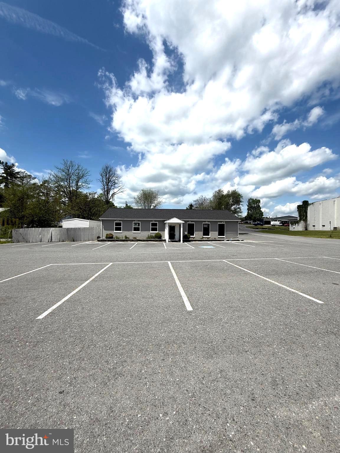 Looking for the perfect space to elevate your business? This prime commercial property in the heart of Martinsburg, WV, has everything you need to make your vision a reality! With just under 4,000 sq. ft. of beautifully redesigned space and ample parking, this property is a showstopper that’s turn-key and ready to impress.
Completely revamped in 2017, every inch of this property has been updated with care and style. From the sleek LVP flooring and new windows that fill the space with natural light to the energy-efficient mini-split system plus two heat pumps, hot water heater, and new roof, no detail has been overlooked. The upgraded lighting adds the perfect finishing touch to this modern masterpiece.
Specifically designed for a salon, spa, or boutique, this space offers unparalleled functionality and charm. The layout also includes a breakroom with a sink and fridge, two stylish dressing rooms, and 2 bathrooms designed with clients and staff in mind.
Located in a high-traffic area, this property ensures your business will be seen and accessible. Whether you’re launching your dream salon, expanding your spa, envisioning a chic boutique, or another business adventure, this property combines functionality, style, and location to set you up for success.
This is more than just a building, it’s the foundation for your next big opportunity. Schedule your private showing today and let your business thrive in this exceptional space!