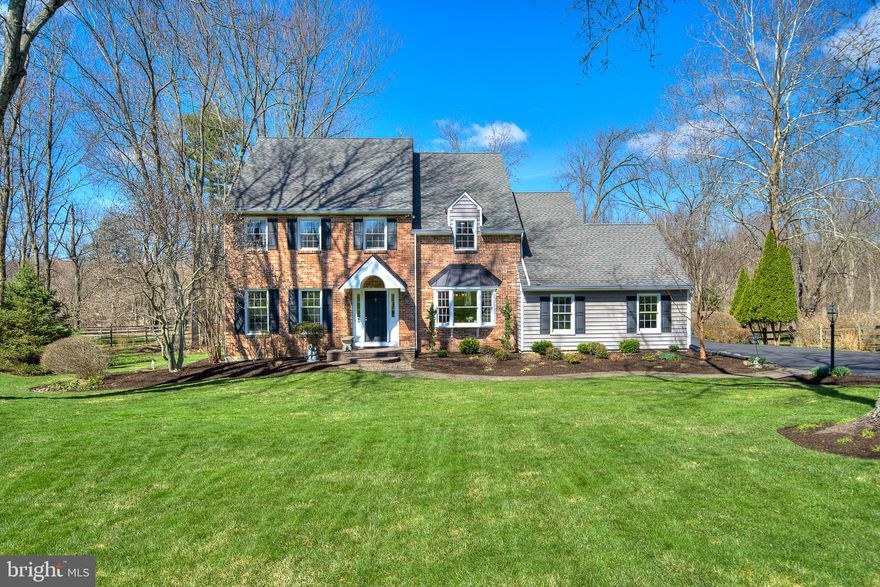 Open House Sunday 1-3pm! Hurry to see this thoughtfully maintained residence set on .42 acres in desirable Plumstead Township, offering the advantage of a Doylestown address within the highly regarded Central Bucks School District. The home features a spacious, well-designed layout with room sizes that exceed typical expectations, creating an open and comfortable flow for both everyday living and entertaining. The main living and dining areas are notably generous, complemented by rich hardwood floors adding an overall sense of warmth. The eat-in kitchen is filled with natural light, highlighted by a vaulted ceiling and skylights, and provides direct access to the deck, which connects seamlessly to the screened porch for easy indoor-outdoor living. The kitchen also boasts granite countertops, an island and a pantry closet on the way to the dining room. Just off the main living space, the den offers a cozy gathering area with a fireplace and French doors that open to the screened porch, enhancing the home’s connection to its outdoor setting. The primary bedroom suite offers generous proportions and a well-planned layout, featuring two walk-in closets, including one that’s the size of a small bedroom.  The attached bath has a tiled walk-in shower with a built-in niche and a double vanity with granite. The three other bedrooms and hall bathroom are everything you’d expect and want.  You also get two linen closets in the hallway.  And keeping with the bonus closet theme, one is huge. A finished basement adds valuable flexibility, well-suited for a media room, home office, fitness area, or additional living space. Throughout the home, the level of care and maintenance is immediately apparent. The current owners have taken an environmentally conscious approach, incorporating a well-planned water filtration and softening system and an efficient lawn irrigation system to maintain the property responsibly. A newer HVAC system ensures year-round comfort, and the two-car garage is already wired for EV charging. Ideally located just minutes from the shops, dining, and charm of Doylestown, this home offers a compelling combination of space, condition, and thoughtful enhancements.