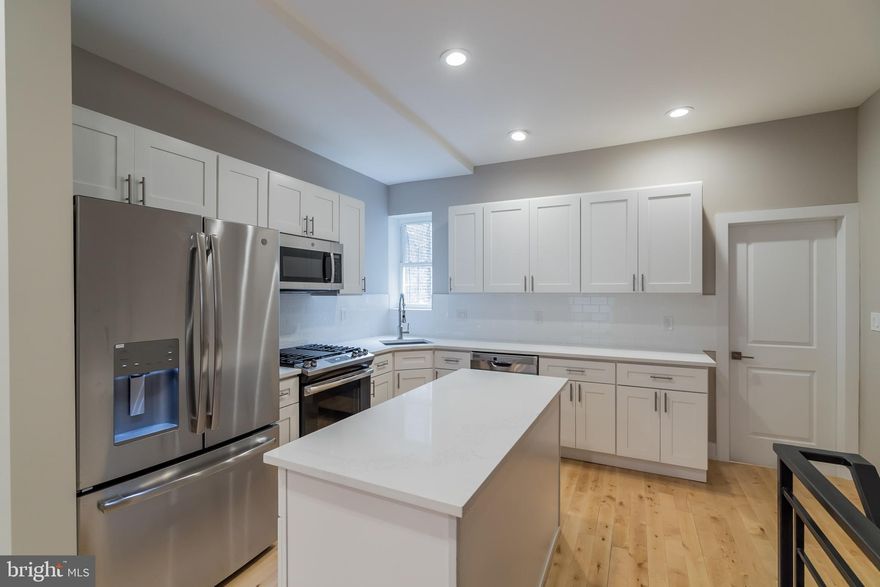 Absolutely stunning 3 bedroom / 2.5 bath end-unit row located in the popular Brewerytown neighborhood of Philadelphia. If you re looking for a move-in ready home in walking distance to area restaurants, public transit and nightlife, this is the home for you! From the moment you approach 1611 N Corlies St, you ll be greeted by a beautiful painted-brick exterior with gorgeous detailing you don t find in newer homes! A huge covered porch is the perfect welcome inside to the open-concept floorplan. All new gleaming hardwood floors pop nicely against the neutral walls and white trim. Our favorite part? We love the pops of exposed brick blended with the modern updates throughout! Enjoy the spacious living room with recessed lighting that flows directly into the over-sized kitchen with brand new island for extra prep and seating space. White shaker cabinetry, white countertops and subway tile backsplash give the kitchen an uber modern feel. Stainless steel appliances include gas range, refrigerator, built-in microwave and dishwasher. A first floor bedroom has been added with a large closet. This room could also be utilized as a formal dining room for those who do loads of entertaining or a home office! The basement has been nicely refinished with an all new powder room and additional storage area. After a long day retire to the amazing master suite! Three huge windows allow natural light to stream in, and the exposed brick is the perfect accent wall for your bed. A large walk-in closet has been added and the master bath is a dream. All new tile flooring continues into an accent wall behind the dual sink vanity and into the frame-less glass shower. The third bedroom feels light and airy with three total windows and recessed lighting. Exposed brick accents give a pop of character! A second full bathroom with a shower/tub combo features subway tile tub surround and accent wall. If outdoor entertaining space is important, you ll love the brand new deck! There is plenty of space for patio furniture and flower pots for those with a green thumb. All new plumbing and electric! Why wait? Contact us today to schedule your private tour! Owner is a licensed, PA realtor.