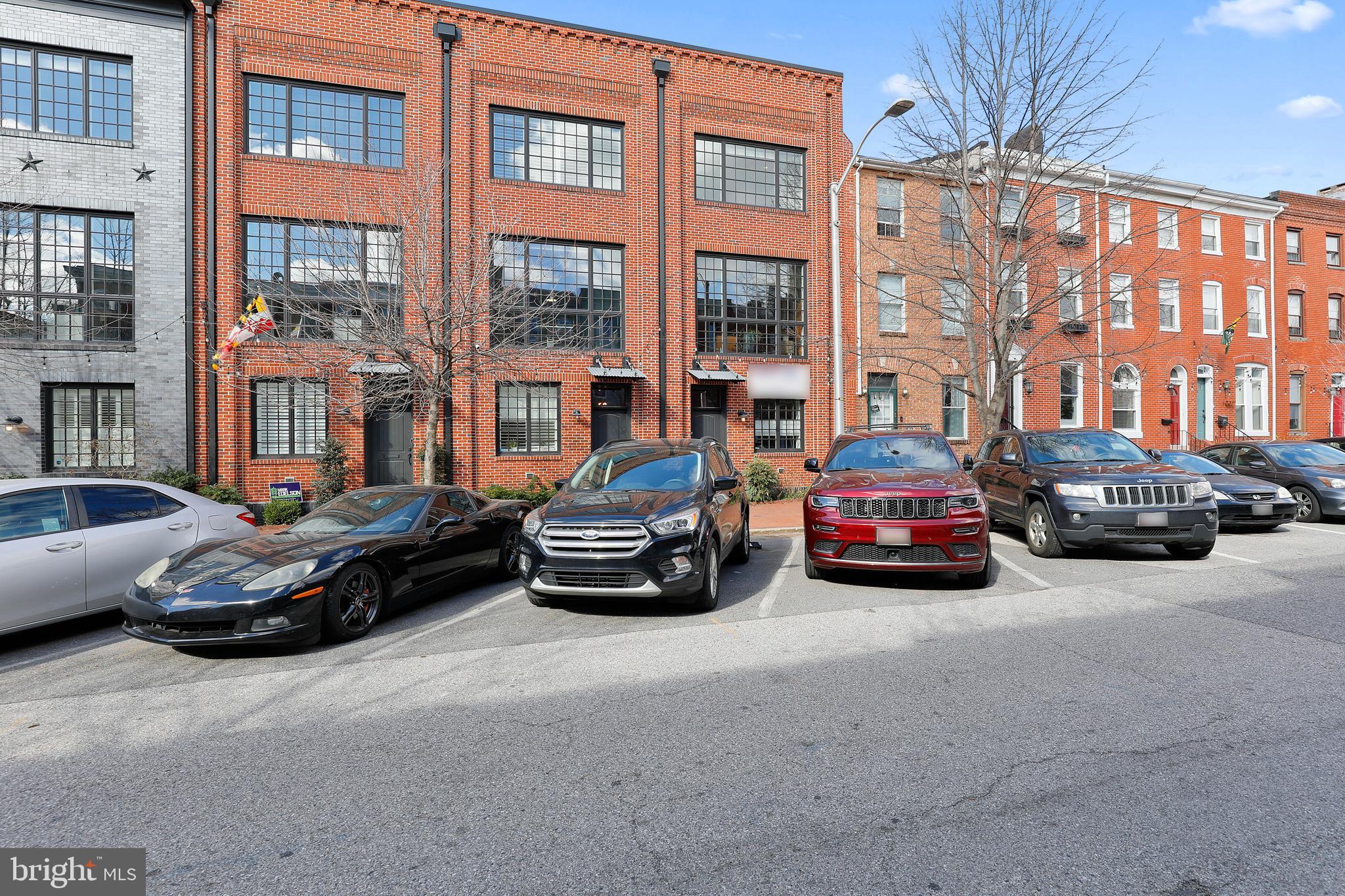 IMMACULATE 4 STORY HOME LOCATED IN UPPER FELLS POINT ON SOUGHT AFTER BLOCK WITH 2 CAR GARAGE PARKING! OVER 2,400+ SQUARE FEET. GLISTENING FINISHED IN PLACE OAK HARDWOODS CASCADE THROUGHOUT. ENJOY CUSTOM CABINETRY, UPGRADED TRIM, IMPORTED TILE, GRANITE COUNTERTOPS, DESIGNER LIGHTING, SS GE MONOGRAM APPLIANCES PACKAGE IN STUNNING CHEF'S KITCHEN WITH UPGRADED WINE FRIDGE. TONS OF NATURAL LIGHT. HIGH CEILINGS. TONS OF STORAGE. WALK-IN SHOWERS. WALK-IN CLOSETS. CUSTOM DUMBWAITER. SPACIOUS 3 BEDROOMS WITH 3 FULL BATHS INCLUDING MASTER SUITE WITH FRAMELESS GLASS SHOWERS. SECONDARY GREAT ROOM ON 4TH LEVEL - GREAT FOR FAMILY ROOM, HOME OFFICE, OR HOME GYM. EXPANSIVE TREX DECK FOR ENTERTAINING WITH AMAZING CITY AND WATER VIEWS. CLOSE PROXIMITY TO RETAIL SHOPPING, LOCAL DINING, PATTERSON PARK, FELLS POINT, HARBOR EAST, AND ALL MAJOR HIGHWAYS. SCHEDULE A PRIVATE TOUR TODAY!