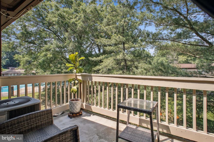 Wonderful updated,  upstairs end unit that faces trees!  Ready to move in!! Freshly painted! Engineered bamboo flooring in living /dining areas! Renovated kitchen with quartz counter tops, wine rack,  mug holder and backsplash! Updated bathroom shower, new cabinet with quartz top! Dual sinks! Laundry area with newer, full sized washer and dryer is hidden carefully behind a curtain! Master bathroom has window for great light and a big walk thru closet! Second, good sized bedroom also has large window and big closet! Lots of storage space thru out! Lighting fixtures have been updated! Enjoy a peaceful moment on the large balcony overlooking the trees and views of the pool! Low condo fee! Owner only pays electric! Plenty of open parking!  West Springfield school pyramid! Close to shopping, restaurants and more! Easy commute with metro bus, VRE, I395, I495 near by! Accotink is near with walking/biking and summer amenities!