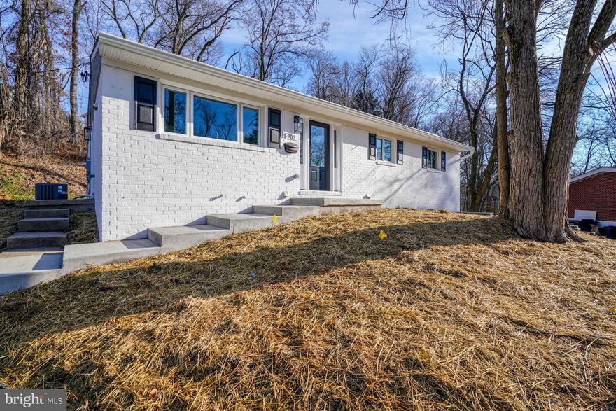 Stunningly remodeled 4BR/3BA Rancher on a cul-de-sac in the quiet neighborhood of SCOTTS HILL .  Step inside the amazing open concept main living spaces that beam with an abundance of natural light and the warmth of luxury plank flooring. A vaulted ceiling makes the space open and airy, and extremely welcoming to anyone who enters.  A large front window is just above the double porcelain sink in a gorgeous kitchen. Plenty of cabinets finished with crown moldings, tons of stunning quartz counter space, a complimenting tile backsplash, stainless steel appliances, floating wood shelves, and a large island with pendant lighting and breakfast seating awaits you in this amazing kitchen.  The grand sized living room offers an open view into the kitchen and the light filled dining room.  Down the hall are two spacious secondary bedrooms, a beautifully tiled full bath, and a large owners suite featuring a large window, a walk-in closet, and a private bath with an elegantly tiled walk-in shower. The lower level offers additional finished living space with room for everyone beginning with a large family room, the fourth bedroom, a home office, a full bath, laundry, storage and sliding doors to a patio with access to plenty of green space.  On the main floor a side door gives you access to the driveway, and sliding doors in the dining room take you onto a large deck that overlooks the yard surrounded with trees.  This home is move-in ready offering so much to any new homeowner, and is in close proximity to shopping, restaurants, and commuter routes.