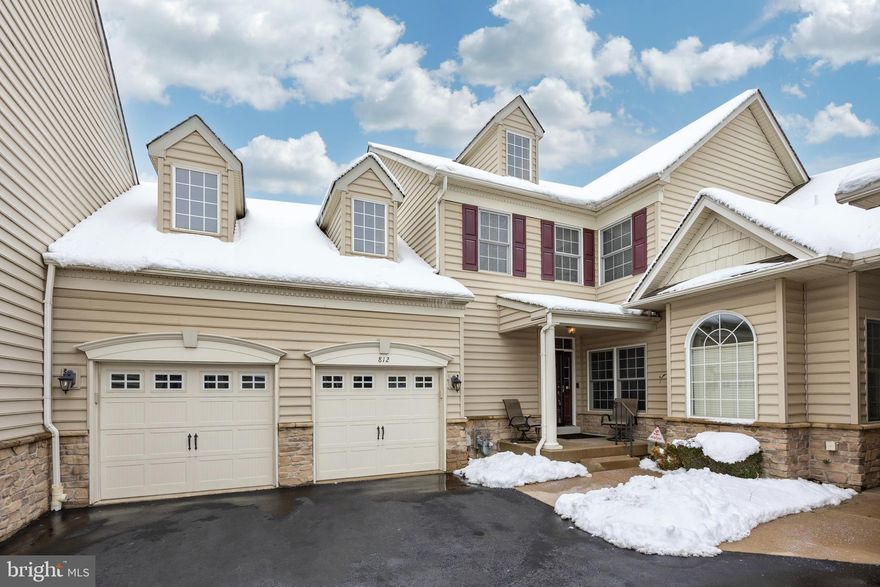 Welcome to easy living in Montgomery Walk, a prestigious and highly sought-after 55+ community! This is the largest model in the community, offering 2 spacious bedrooms, 2 full bathrooms, and 2 half bathrooms in a thoughtfully designed layout that combines comfort, style, and functionality. The OPEN FLOORPLAN makes this a great home for entertaining family and friends and hosting holiday gatherings.

Step inside to a welcoming open foyer with high ceiling,  gleaming HARDWOOD floors, turned staircase, coat closet and a conveniently located powder room. There is a private office to the right featuring a striking board and batten accent wall—adding character to the space. The office provides excellent flexibility and could potentially serve as a 3rd bedroom if needed.
The beautifully UPDATED kitchen is a true centerpiece, showcasing NEW luxury vinyl plank flooring, 42" WHITE cabinetry, CORIAN countertops, tile backsplash, STAINLESS STEEL appliances, a GAS stove, recessed lighting, and under-cabinet lighting for both style and functionality.  A stunning 67" x 38" OVERSIZED center island provides generous prep space, additional storage and seating—perfect for entertaining —while a dedicated area for a kitchen table offers additional everyday dining space. Just off the kitchen, step out onto the private deck—ideal for morning coffee or relaxing evenings. A conveniently located laundry room sits off the kitchen with direct access to the spacious oversized 2-car garage.

The dramatic two-story living room is filled with natural light from a full wall of windows and is anchored by a cozy GAS fireplace with marble surround, creating an inviting atmosphere for gatherings. The main-floor PRIMARY SUITE features vaulted ceilings, ceiling fan, a breathtaking window to allow for natural light,  two walk-in closets, and a private ensuite bath with a walk-in shower and double bowl vanity.
Upstairs, you'll find a spacious second full bedroom with its own walk-in closet, ceiling fan, a full bathroom, and a versatile loft that overlooks the living room—maintaining the open, airy feel of the home while providing flexible living space.
The FINISHED walk-out basement is designed for entertaining, complete with a bar area, half bathroom, and a beautifully finished knotty pine ceiling that adds warmth and character. There is ample storage space in the unfinished part as well as under the stairs. Step outside to the paver patio for additional outdoor enjoyment.

Residents of Montgomery Walk  enjoy access to a clubhouse within walking distance featuring a beautiful outdoor pool, hot tub, tennis court, putting green, billiards room, theatre/media room, lounge area, and a fitness center with sauna—offering resort-style amenities right in your own neighborhood!
With its generous layout, modern finishes, and low-maintenance lifestyle with easy access to major roads, shopping and dining, this home truly offers it all!  Schedule your personal tour today!