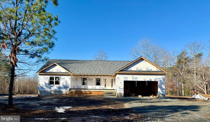 Under Construction –  | 4 Beds | 3 Baths | Over 2,600 Finished Sq Ft | 4 Acres



Step inside to an open-concept layout designed for today’s lifestyle. The inviting living room features a cozy fireplace—perfect for relaxing or entertaining on cool evenings. The gourmet kitchen is a true showstopper, boasting soft-close cabinetry, a large center island, farmhouse sink, stainless steel appliances, tile backsplash, and granite countertops.

The spacious primary suite offers dual closets—including a custom walk-in—and a barn door leading to a beautifully designed bath with custom tilework and a soaking tub.

Downstairs, the fully finished lower level expands your living space with a large family room, 4th bedroom, and full bath—ideal for guests or multi-generational living.

Enjoy peaceful mornings on the front porch or take in beautiful views from the back deck. Every detail of this home is thoughtfully designed, combining custom craftsmanship and modern style in a picturesque setting.

This is more than just a home—it’s a lifestyle. Schedule your tour today!