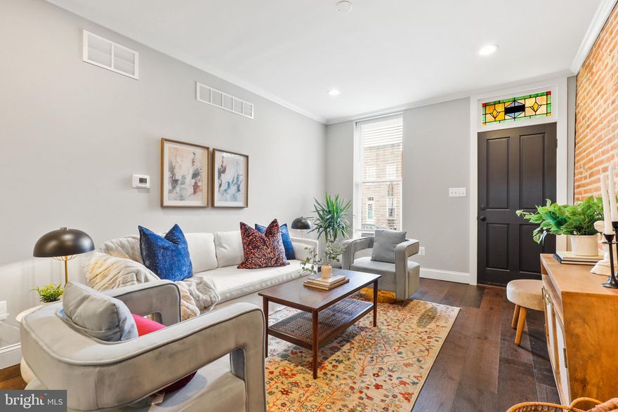 Nestled in the vibrant Locust Point neighborhood, this exquisite 4-bedroom, 3-bathroom townhouse offers a harmonious blend of historical charm and modern luxury. Built in 1875, the home resonates with Baltimore's rich history, while its recent updates provide all the comforts of contemporary living.

As you step inside, the warm embrace of natural wood flooring and recessed lighting welcomes you. The gourmet kitchen, a chef's delight, features stainless steel appliances, elegant countertops, and a convenient breakfast area. The open floorplan, accentuated by crown molding and built-in features, creates a seamless flow for entertaining and daily life. The home's thoughtful design extends to the finished basement, boasting a generous 440 sqft of additional living space, perfect for a family room or home office.

Upstairs, the bedrooms offer serene retreats, each with ample space and natural light. The primary suite features a luxurious bath, ensuring a private and peaceful haven. Additional amenities include energy-efficient appliances, a central air conditioning system, and a cozy backyard for outdoor relaxation.

This townhouse is a rare gem in Baltimore City, offering the convenience of off-street parking – a prized feature in the urban landscape. The property's brick construction not only adds to its aesthetic appeal but also stands as a testament to its sturdy and enduring nature.

Discover the perfect blend of historical elegance and modern comfort at 1410 Hull St – a home that promises a lifestyle of convenience, style, and tranquility in the heart of Baltimore.