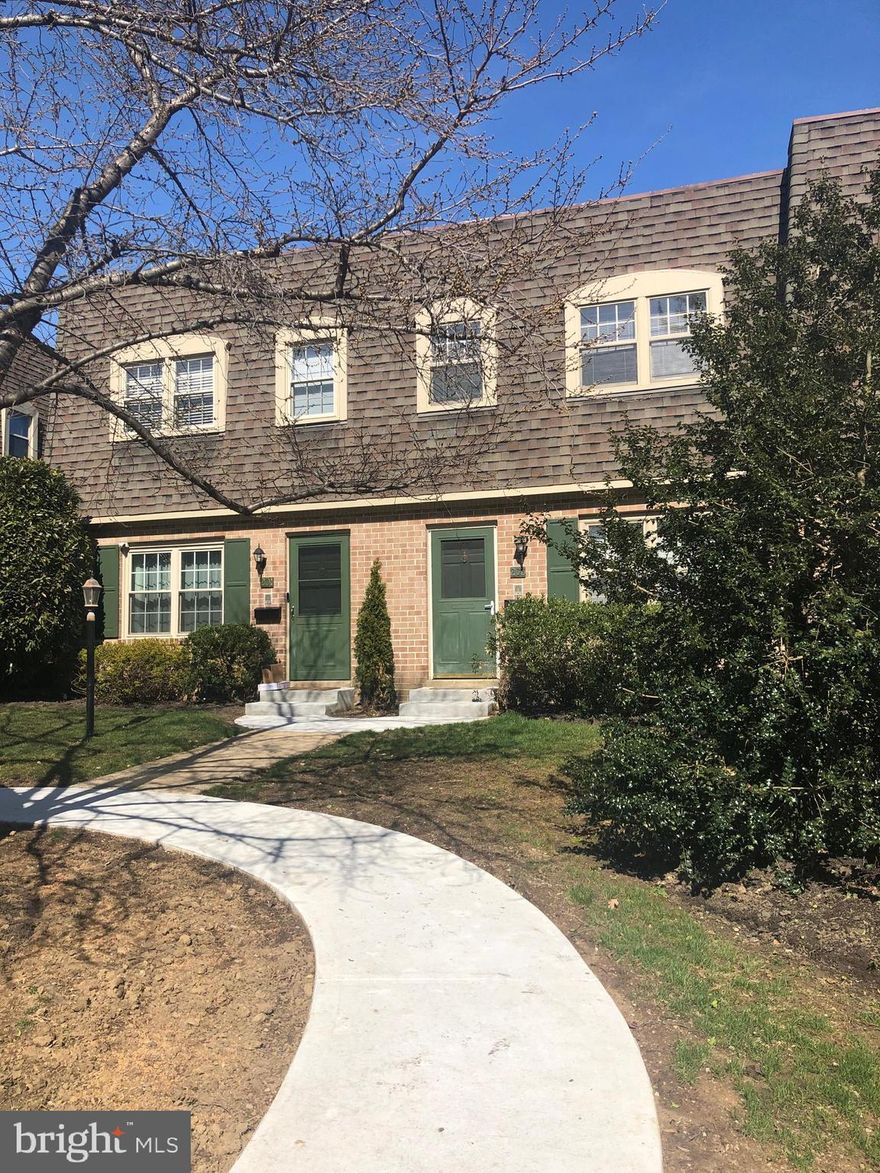 Wayne 3 bedrooms, 2.5 bathrooms townhouse. Radnor township.  Very convenient location to center of Wayne.  Main floor features living room with fireplace and crown moldings, dining room, kitchen, powder room and sliding glass door to enclosed brick back patio. Hard wood floors. Carpet up the stairs and 2nd floor landing. Kitchen has white cabinets, blue solid surface counters with mirrored back-splash, and a window. 2nd floor has Master Bedroom with walk-in closet & master bath with stall shower, 2 additional hall bedrooms, Hall bath with tub, & linen closet. Paneled Lower Level Room with recessed lighting. Large Laundry/Storage room has ample built-in shelving. Parking right out the back door! Close distance to schools, train, parks, biking/hiking trail, and shops & restaurants in downtown Wayne.