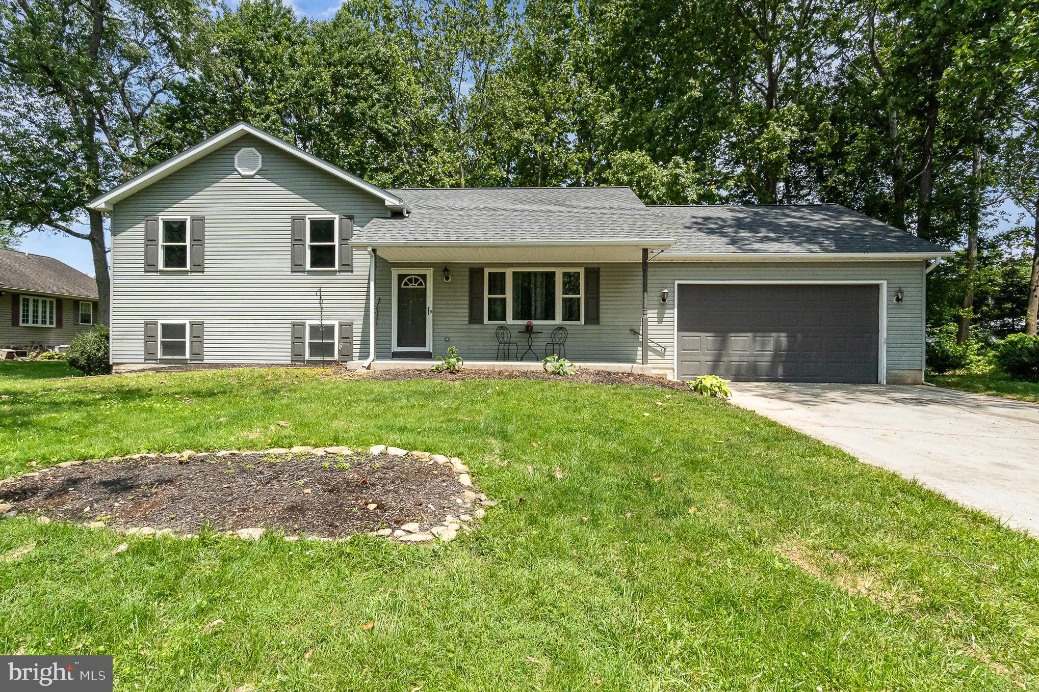 YOU MUST SEE THIS HOME NOW, FEELS SO FRESH AND NEW, ALL NEW PAINT AND FLOORING JUST ADDED. A NEW KITCHEN ISLAND AND STOOLS JUST ADDED. Are you Looking for a large home with 4- Bedrooms and 3 full Baths, then this home is for you at 3 Crocus Trail. Enjoy a full living room on main level and a family room on lower level. Lots of storage areas. Eat in Large Kitchen with Back Splash and kitchen island. Brand New roof 5/2025 A Sunroom for relaxing. 2 Car Garage and Shed. Great location on Cul-de-sac, Yard is flat, and home is on Public Sewer. Close to Md Line, 2 Golf Courses and Ski Liberty.