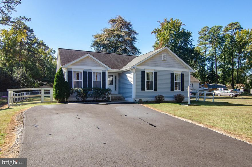 Improved price!  Enjoy the river lifestyle in this move-in ready  home with open floor plan, 3 bedrooms/2 baths.  Features low maintenance and low utility costs with updated HVAC, Pellet Stove, Tankless Water Heater, fresh asphalt driveway, fully fenced backyard,  large storage shed.   Appliances convey.  Voluntary HOA with Potomac River swimming beach.  Boat ramp, community pier with boat slips on the protected water of Monroe Bay.  Community events and clubhouse with picnic grounds -- all these amenities are accessible by golf cart!  Great location near town of Colonial Beach, Dahlgren and only 90 min to DC or Richmond.