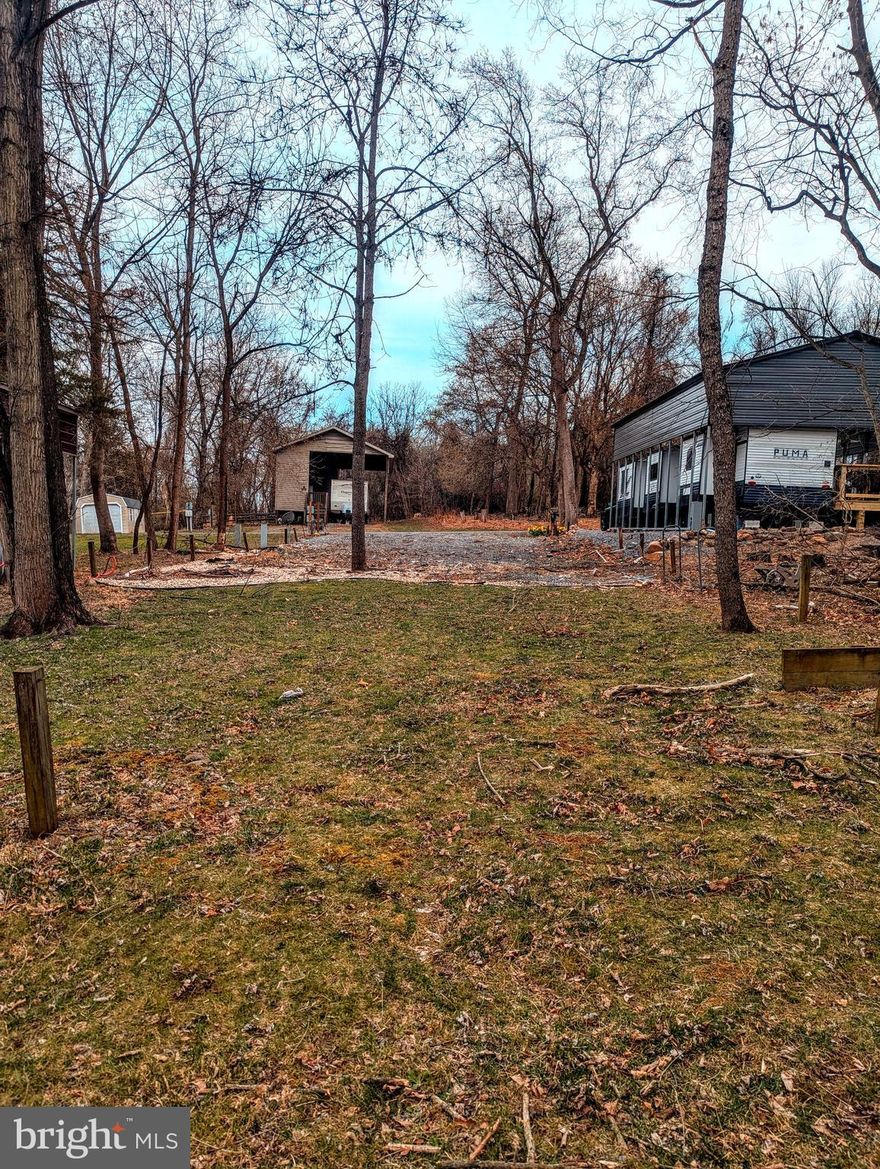 This is a gated community, so you need to enter at the guard shack. Entry is not permitted without ID per the office rules. Bring IDs to the office or guard shack for visitor pass. THIS IS A SEASONAL CAMPGROUND! OPEN FROM APRIL 1 TO NOVEMBER 1. Large empty lot to bring your camper and make your own to enjoy time with your family & friends. River Bend is a privately owned 400 acre recreational- vehicle camp resort with seasonal activities for members, families and guests. Less than a 2-hour drive from the Washington and Baltimore metro area. Open with utilities from April 1 to November 1. Lot owners have access to their property the entire year. *** Members Enjoy *** * Amazing views and wildlife, Potomac River access, Trails, Swimming pools, Mini-Golf, Youth center, Tennis and basketball courts, laundry facilities, convenience store, deli and lounge. *Bath houses throughout the park, boat ramp, bar and grill and even a church located on the grounds. River Bend also hosts numerous activities such as 4th of July fireworks, small carnival, bonfires, poker runs, horseshoe tournaments, car show, Halloween Trick or Treat and so much more. The river is deep water for swimming, tubing and water skiing. CAN NOT LIVE HERE YEAR ROUND.