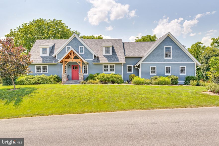 This stunning custom home features tons of unique details throughout. We begin on the slate front porch with post and beam accent. You don't see those details everyday. Inside we have a large foyer with porcelain tile and a stained glass entry door to the main home. Here we have the spacious kitchen. It features cherry floors and solid maple, cherry finished cabinetry. This is topped off with quartz counters. All appliances are stainless steel including the gorgeous Blue Star gas range with custom vent hood. You're going to love cooking in this space! Off of the kitchen there is a convenient mudroom. It features 2 large closets, porcelain tile floors, quartz countertops, and single bowl single. You have direct access to the 3 car garage from here. On the other side of the kitchen you have the large dining room with Brazilian cherry floors. It opens to the large, screened in porch. Beyond the dining room we have the glorious living room. Brazilian cherry floors continue into this space. It features walls of windows to let in tons of natural light and beautiful cathedral ceiling. The space includes a custom Tulikivi masonry fireplace. The soapstone looks gorgeous! The main level also has a nice powder room with stone floors and pedestal sink. The primary suite is located on the main level. This is a great bonus for those moving toward retirement age. No worries about going up and down those stairs. Primary bedroom features those same beautiful Brazilian cherry floors and cathedral ceilings. There is a large walk-in closet with built-ins. Beyond this you have your private ensuite bathroom. It features double bowl vanity with cherry finished base, free standing soaking tub and walk-in shower with glass door and dual showerheads. I mean what more could you ask for! Your laundry machines are also conveniently tucked away in here. Upstairs you have nice airy loft space with cathedral ceilings and post and beam construction. It gives you a beautiful overlook to the living room.  You have two nicely sized bedrooms on this level with oak hardwood floors and ample closet space. The hall bath includes ceramic tile floors, double bowl vanity with dressing table, and tub/shower with tile surround. There is a large bonus room upstairs as well. It features hickory floors and a separate split zone unit. There are a ton of potential uses for this space. It would make a great craft room, lounge, or work from home space. Make it your own! The lower level features a large rec room, an unfinished workshop, and mechanical room. There is a nice "wash" room with porcelain tile floors and sink. There is a full bath on this level with ceramic tile floors, single bowl vanity, and tub/shower combo. Outside you have a spacious screened in porch with ceiling fan. Beyond this you have a very large deck with great views of the 6th Fairway and golf course. Stairs walk down to the lovely rear yard. It has been beautifully landscaped. On the lower level you have a beautiful stamped concrete patio. Tons of space to enjoy the outdoors. Stamped concrete pathway also leads from the 3 car garage to the front door. Just lovely details all around. This home has so much to offer!